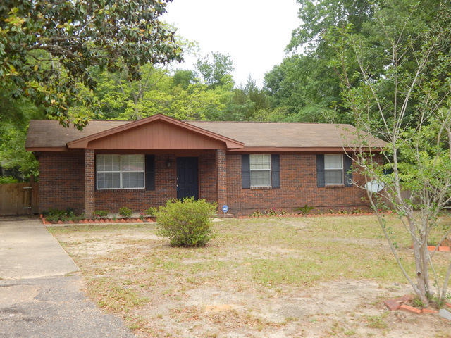 Wonderful and solid home that would be a great investment property, starter home or home to retire in. The home comes with an oversized, shaded lot, fenced back yard, newer HVAC system and termite Bond. Inside you will find a ''carpet free'' home. All floors are easy to care for. 3 bedrooms, 2 fulls bathrooms and the master bathroom has a step in shower for easy access. There is a tankless , instant hot water system, a new kitchen has been installed about 5 years ago. This included new cabinets, counter tops and flooring. Come by and take a look at this all brick home, under 100K before it is SOLD!