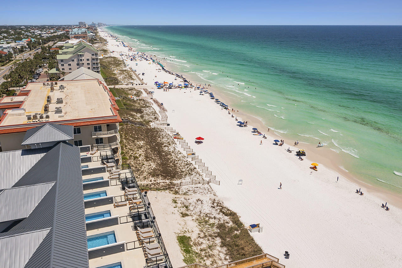 Destin's newest  luxury beachfront project. Only 10 townhomes, each with a private pool. Completed and introduced to the rental market in late March 2021, Unit will top $200K in gross rental income with heavy owner usage. Rental income for 2022 is projected to top $330K. With private beach access, luxurious in-unit amenities, elegant design, and a premier location in Crystal Beach, Henderson Beach Villas sets a new trend in sophisticated coastal lifestyles on the Emerald Coast. Each villa is equipped with a private movie theatre, a rooftop gunite pool, 4 floors of outdoor space, and an in-unit elevator. Professionally designed by Duce & Co, this 3,160-sqft, 6-bedroom villa features 4 floors of luxurious interiors with 10' first-floor ceilings, and high-impact retractable glass sliders. No detail is left untouched, including quartz, marble, and quartzite surfaces in kitchen and baths; Sub-Zero and Wolf appliances; and custom shaker cabinets.

The beach is given center-stage at every chance. See-through glass surrounds on the balconies and rooftop deck elevate views of turquoise waters. The expanded, 102-sqft ground-floor patio extends deep into the sugary white sands to create optimal lounging. The 658-sqft-rooftop deck is the perfect post to watch Destin's famous sunsets across the Gulf of Mexico. In addition to the heated, 9'x16' gunite pool, the rooftop includes a covered cabana, grill area, and storage. The theatre room offers the next best view with full projection and raised seating. Henderson Beach Villas has considered every aspect of luxury coastal living, including privacy and noise with soundproof dual acoustical panels and firewalls between units; soundproofing between floors; and sound mats under all levels. This villa is pre-wired for Control4 smart home operating and includes a full home sound system. This 10-unit community offers 2 parking spaces per unit plus 5 extra spaces, gated beachfront access, and a private beach walkover.