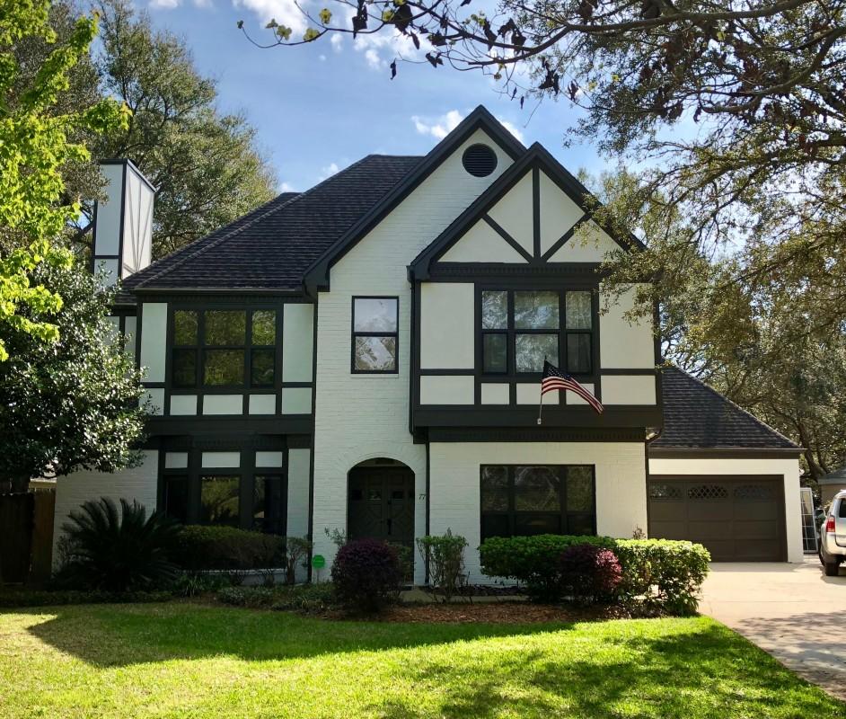 Beautifully updated timeless Tudor located inside the peninsula of Lake Lorraine itself. This refined and spacious home is reminiscent of Rosemary beach and the houses along 30A and sits on an incredible, professionally landscaped lot with water views and mature oaks throughout. 77 Sunrise has been completely remodeled and reinvented for 2018. The kitchen is a chef's dream featuring a brand new electric range, dual convection ovens, new refrigerator/freezer and new dishwasher. The freshly installed marble countertops are expansive and the large pantry will neatly accommodate your storage needs. The downstairs living area and office/library have been freshly painted and are now tiled with beautiful Larix ''Hardwood'' porcelain for timeless and carefree flooring. The generous master bedroom with vaulted ceilings leads to the luxurious master bath with large whirlpool tub, lavish stone shower/spa, his and hers sink/dressing areas, and a spacious walk in closet. The two guest bedrooms both feature tranquil views of the front and back yards, have been freshly painted this year and share a newly renovated full bath with dual sinks. The two-car garage and two separate attic spaces provide tons of indoor storage options, and a well-maintained shed and extra parking pad offer additional overflow exterior storage space (to include room for a medium-sized boat). Don't miss out on this incredible opportunity to live in a sophisticated new home with an unbelievable backyard just a stone's throw from Lake Lorraine itself. Come find out what it means to be a part of the Lake Lorraine Estates community!