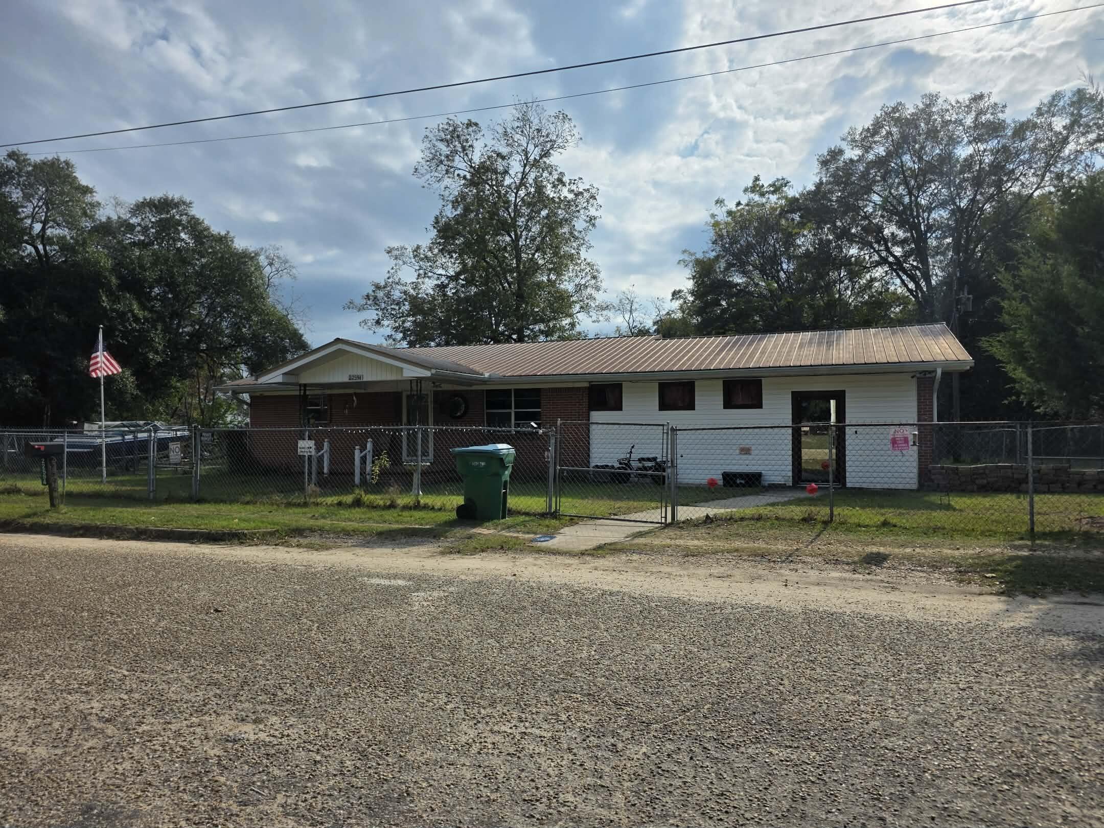 Large 3-bedroom brick home located in Florala, AL sitting on 0.85 of an acre! Home welcomes you to a large family room that includes a 1/2 bath and is perfect for any large family. Once used as a in house daycare the home offers a unique floor plan. Home includes a nice size kitchen, breakfast area, great size laundry and pantry room to include extra storage and 3 large size bedrooms. Home has a great covered back porch with the main part of the yard fenced for afternoon outside playing and also able to keep your animals safe and secure. Home has tons of room and comes with the ability to buy affordability and turn it into your own home with a little work. Also includes an extra vacant lot as well as storage sheds and outbuildings with power.