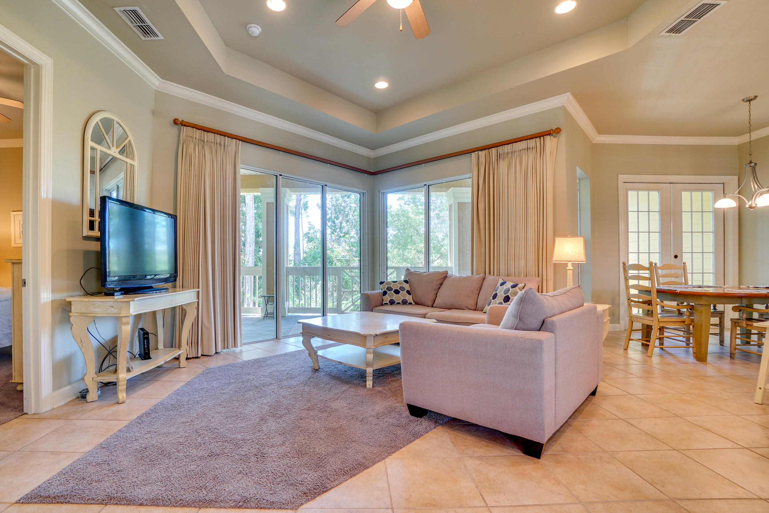 Perfect Sandestin condo in Crystal Cove! In GREAT CONDITION! This condo is comfortable, tight, clean and easy to maintain.  It has tons of windows allowing in natural light and a fantastic glass door system that pours onto a huge balcony that offers complete privacy as it backs up to peaceful and secluded woods. Definitely a perfect spot for your morning coffee or afternoon glass of wine. The large bedroom features french doors that also lead out to the balcony. The kitchen has everything you need whether you are living here full time, as a second home or renting it out as an investment property. There is dining for four and the living space has plenty of room to stretch out and relax in.  There is assigned parking for your car and your golf cart! (even a charging station). The Crystal Cove Owners have private access to a back gate where you can enter/exit via Mack Bayou Rd. Crystal Cove is just a golf cart ride or walking distance to all the amenities of Sandestin and Grand Boulevard.

Convenient in unit Laundry room with full size washer and dryer. Exterior architecture: hardi-plank and stucco siding, metal roof, and Bermuda Shutters. Your location within the Sandestin Golf and Beach Resort allows for easy access to some of the country's best amenities all by walking, biking, golf cart or resort tram including: 4 championship golf courses, tennis courts, marina, restaurants, shopping, fitness center; the ''Grand Boulevard'' shopping area is just a stone's throw away with upscale stores and restaurants like Emerill's, Fleming's and PF Changs, Publix grocery and a movie theatre! Short-term rental capable - would be a super sharp investment, 2nd home or permanent residence.