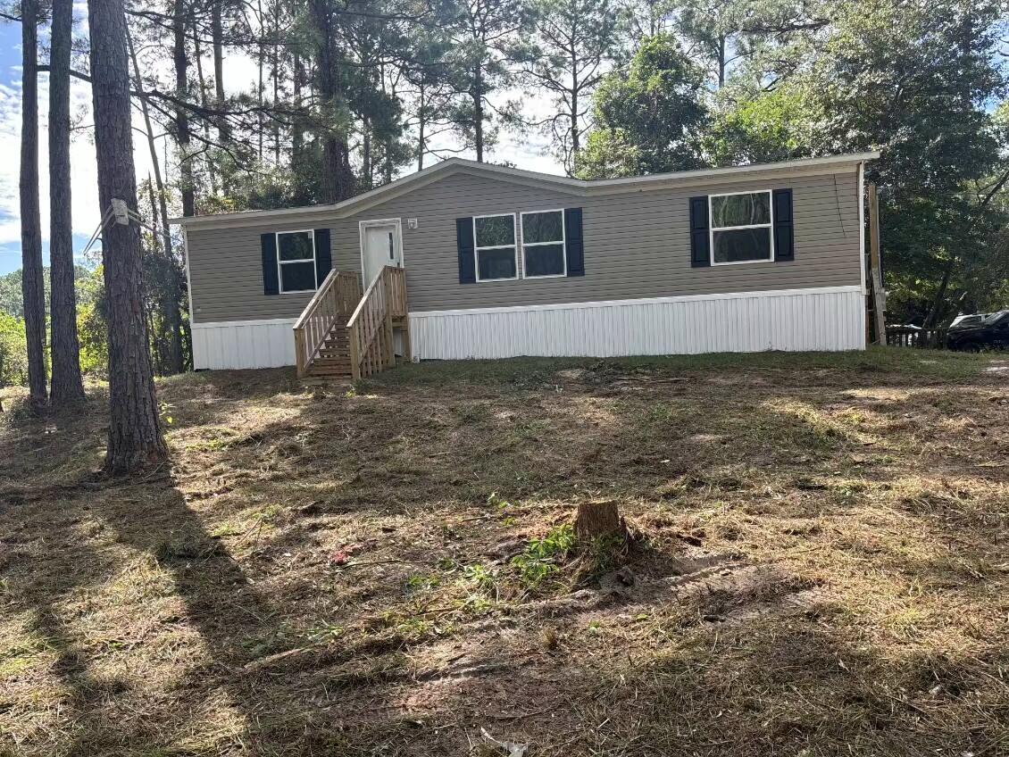 Brand New Manufactured Home on a Double Lot in Santa Rosa Beach, FL

Experience the best of coastal living and convenience in this brand new manufactured home. Situated on a generous 100' x 125' double lot, this property offers an exceptional opportunity for a peaceful lifestyle with plenty of room to expand.

This home's location is a boater's and beachgoer's dream. You'll be just 1 mile from a public boat launch on the bay, providing easy access to the water for a day of fishing, kayaking, or boating. The stunning white sand beaches of Santa Rosa Beach are only 3.5 miles away, making spontaneous beach trips a breeze. With 1,264 square feet of living space, this 3-bedroom, 2-bathroom home features an open floor plan that connects a spacious living room, a separate dining area, and a functional kitchen with a convenient island. The primary bedroom is a true retreat, complete with its own private bath and a generous walk-in closet. Two additional bedrooms and a second full bathroom provide ample space for family or guests.

This home is not only a fantastic find but also puts you in a highly desirable location close to everything Santa Rosa Beach has to offer. Enjoy a wide variety of local shopping, world-class dining, and entertainment options just a short drive away.