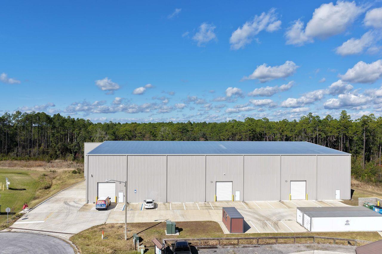 Rare opportunity to acquire AN industrial warehouse, tallest in county, located within Beach Commerce Park  Offered at $6,590,000, this owner-occupied facility can be vacated at closing, What sets this property apart is its extraordinary clear height, measuring approximately 48 feet at the center of the building and 41 feet at the lowest point, far exceeding standard warehouse heights. Typical industrial buildings in the area range from 18-24 feet clear, with newer construction rarely exceeding 30-32 feet. This dramatic vertical advantage creates exponentially more usable storage volume, building features a large clear-span layout, steel-frame construction, concrete slab foundation, metal panel exterior, and multiple overhead roll-up doors