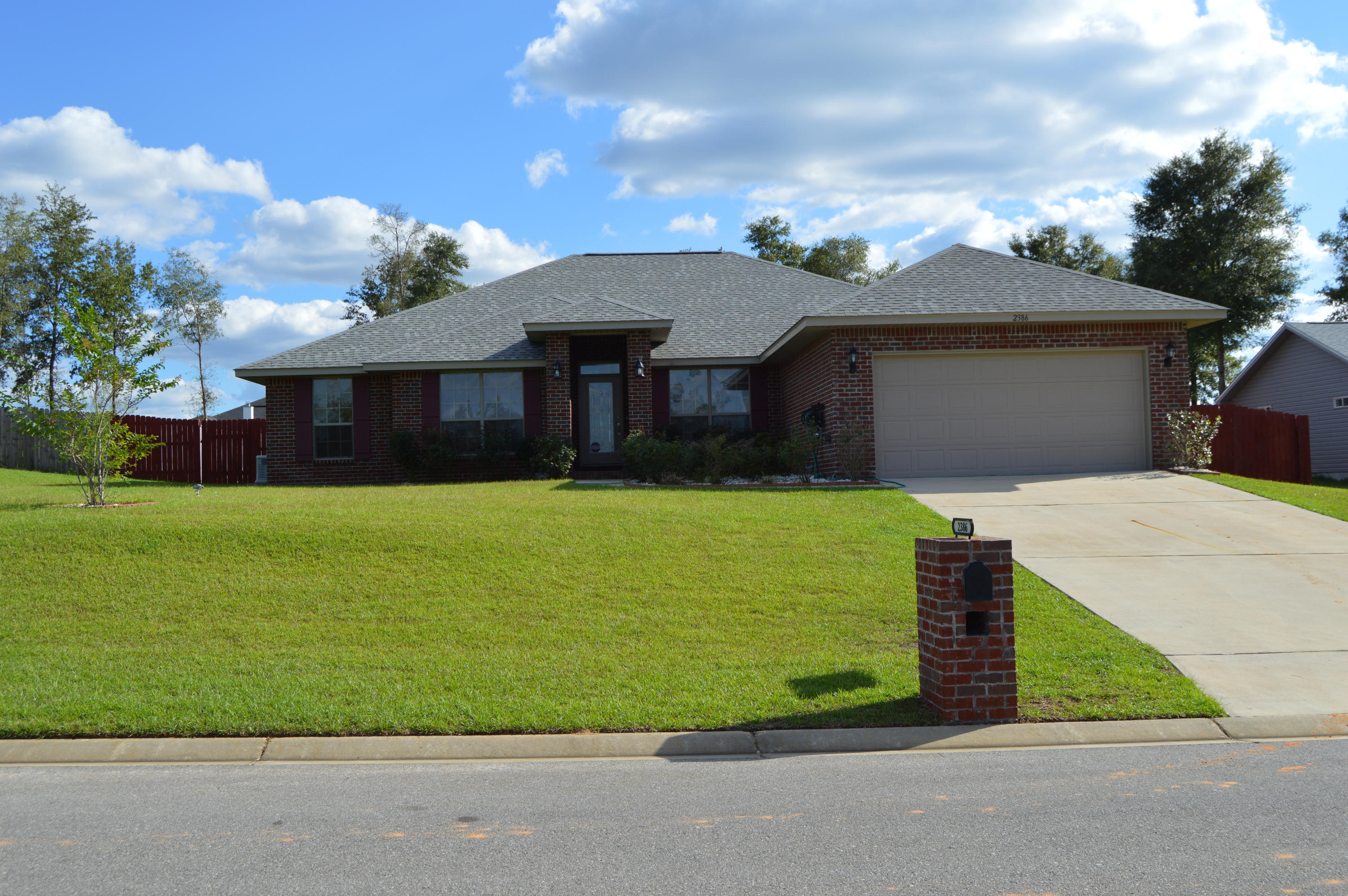 Country living near the city! Call today to view this like new 4BR/2BA home on a large lot with an open floor plan that includes a large family room, open kitchen and breakfast nook, formal dining room, den/office, split bedroom plan with master having raised ceiling, master bath has his/her walk-in closets, double vanity with granite counter, garden tub and separate shower, three additional roomy bedrooms, an additional hall bath with granite counter, an inside laundry room with built in cabinets, a two car garage with opener, a privacy fenced yard with a wood swing-set and nice workshop w/ loft. Owner is leaving his riding lawn mower for tenants to use and the home has a built in generator so you will never be without power! Pet considered on case by case basis.