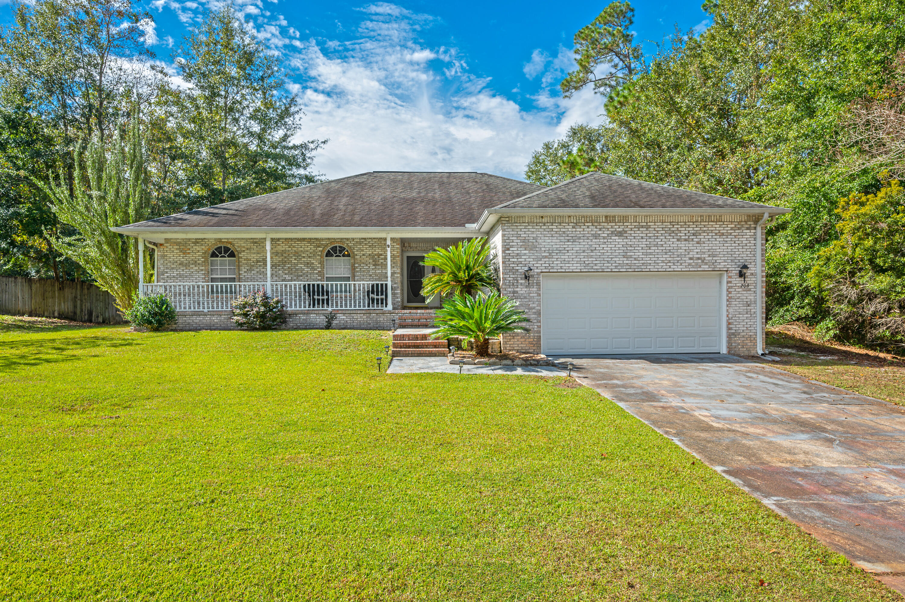 EVERYBODY'S ASKING! What's available South of I-10? This all-brick contemporary 4/2 boasts a welcoming front porch ready for those rocking chairs. Updated with luxury vinyl planked flooring in main living areas, carpet in bedrooms, kitchen has granite counters and stainless steel appliances.  Screened in brick back patio adds a special touch for relaxing and entertaining, also provides access to the large level fenced back yard.  This home has a three year old HVAC system both inside and out, roof is 6 yrs old. Home-happiness is just a call away