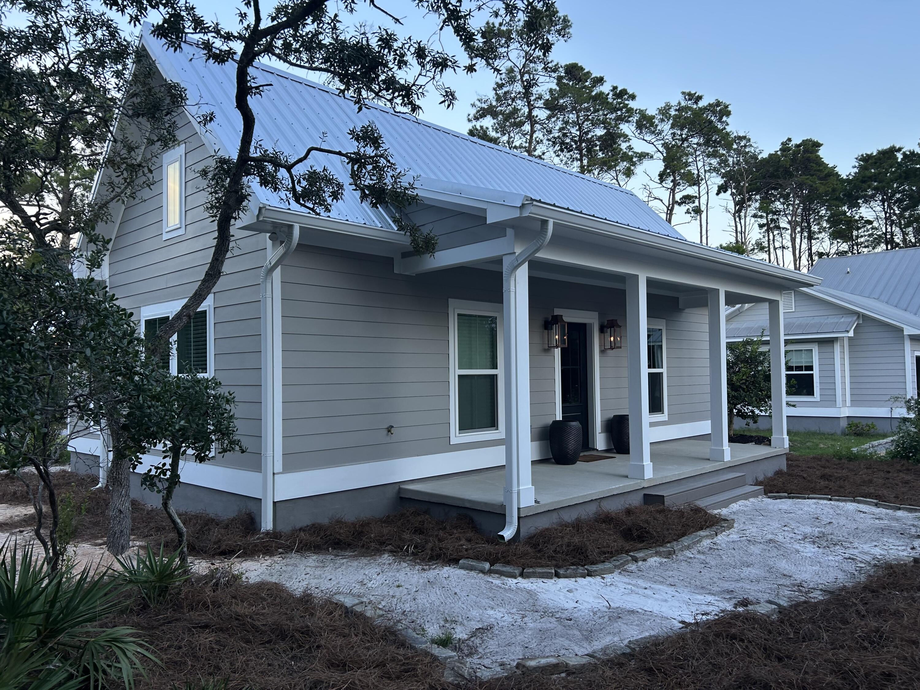 Brand new Florida Cottage for rent 6 months minimum. $2200/month Unfurnished plus electric. This 2 bed/1 bath cottage features vaulted ceilings, upgraded flooring, cabinets, countertops, appliances, washer/dryer, lighting, ceiling fans, large walk-in shower. gas lanterns, on demand hot water and many other features.