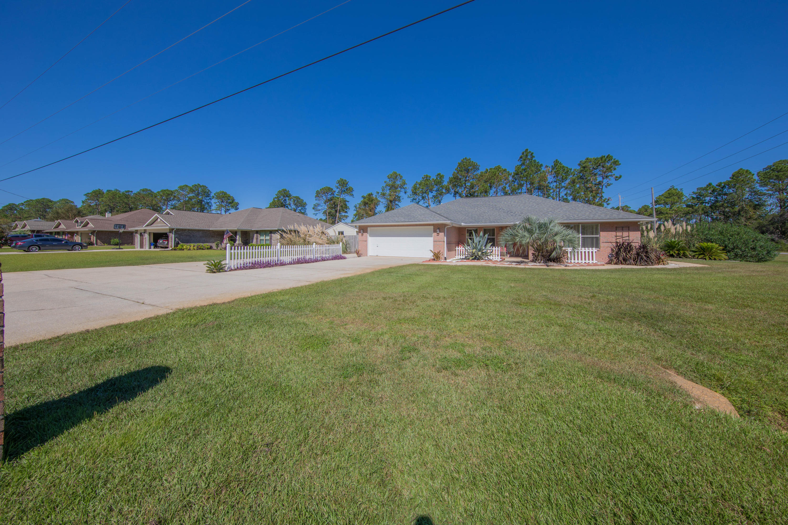 Welcome To Navarre.  This all Brick 4 Bed, 2 Bath home is move in ready and boasts a spacious lot, 2 car garage, 12 car driveway and brand new Luxury Vinyl Plank flooring. It also has and outdoor building/ shed thats perfect for a handyman, man cave, kids play house or storage.  Don't Miss out!