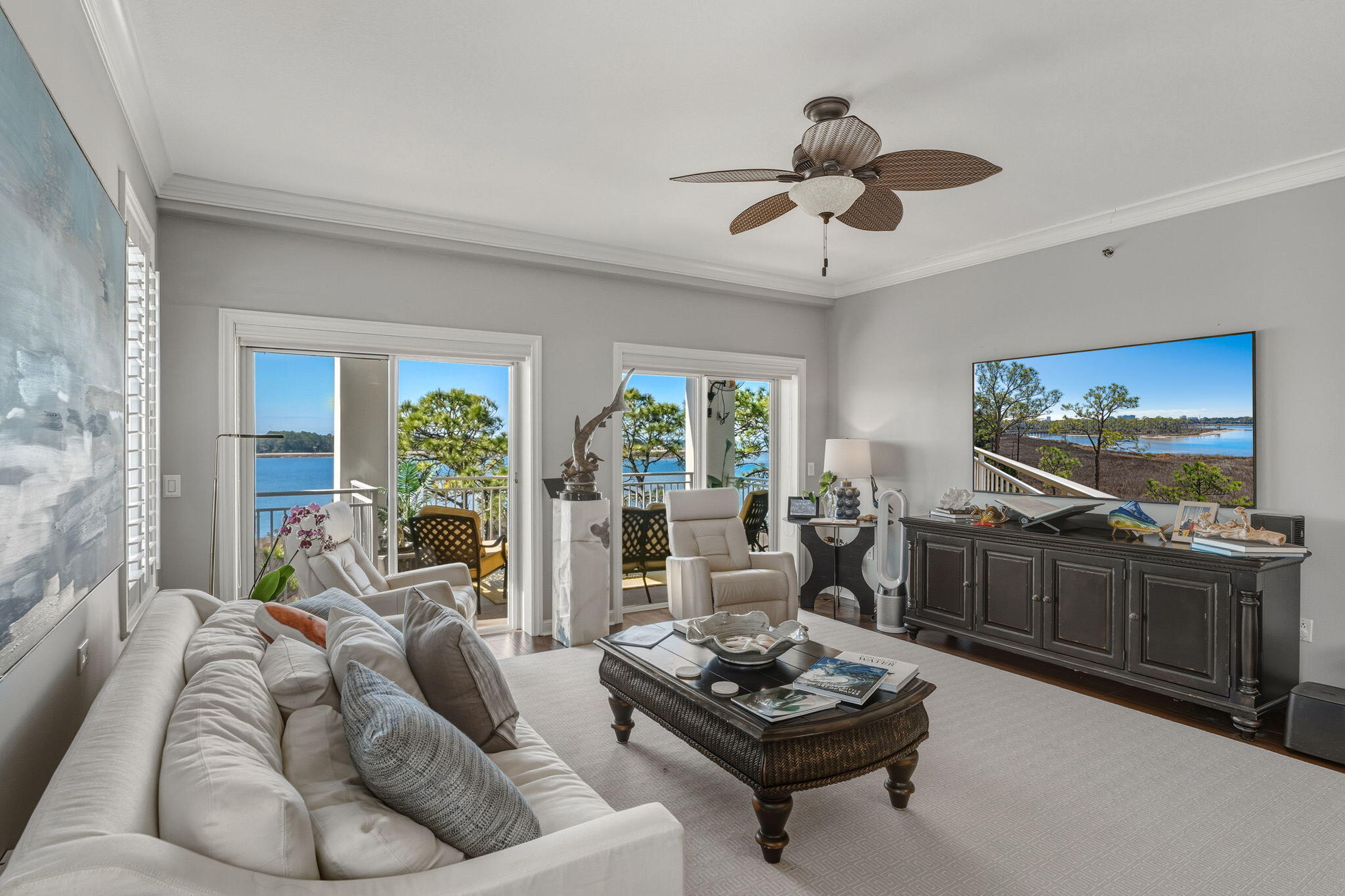 Situated within the exclusive, gated enclave of The Anchorage at Sandestin Golf and Beach Resort, this exquisite three-bedroom, three-bath condominium offers a serene coastal retreat with breathtaking views of Choctawhatchee Bay, Jolee Island, Horseshoe Bayou, and the Sandestin Marina. Thoughtfully designed with high-end finishes and filled with natural light, this furnished residence is ideal for those seeking a tranquil primary or second home in one of the most coveted non-rental communities along the Emerald Coast. The open floor plan showcases elegant hardwood flooring throughout the living spaces, complemented by floor-to-ceiling sliding glass doors that open to a spacious waterfront balcony — an ideal spot for enjoying spectacular sunsets over the bay. The kitchen is both stylish and functional, featuring white cabinetry, stainless steel appliances, a subway-tile backsplash and a breakfast bar perfect for casual dining. The newly furnished primary suite offers direct balcony access, allowing for stunning water views, while the ensuite bathroom boasts a jetted tub, separate shower and double vanity. Two additional guest bedrooms provide picturesque views of either the bay or the private pool, with beautifully renovated bathrooms featuring quartz countertops and modern vanities.  providing ample space for vehicles, beach gear, and golf carts. Residents of The Anchorage enjoy access to a private pool and the quiet luxury of a non-short-term rental community. As part of the Sandestin Golf and Beach Resort, homeowners have access to more than seven miles of pristine beaches and bayfront, four championship golf courses, a state-of-the-art tennis and pickleball center with 15 courts, multiple pools and a full-service marina. The nearby Village of Baytowne Wharf offers boutique shopping, dining and year-round events, while Grand Boulevard provides additional upscale conveniences  all accessible by golf cart. Beautifully decorated and designed for effortless coastal living, this rare offering at The Anchorage presents an unparalleled opportunity to enjoy Sandestin's premier waterfront lifestyle in a peaceful, private setting. Beautifully decorated and designed for effortless coastal living, this rare offering at The Anchorage presents an unparalleled opportunity to enjoy Sandestin's premier waterfront lifestyle in a peaceful, private setting.
