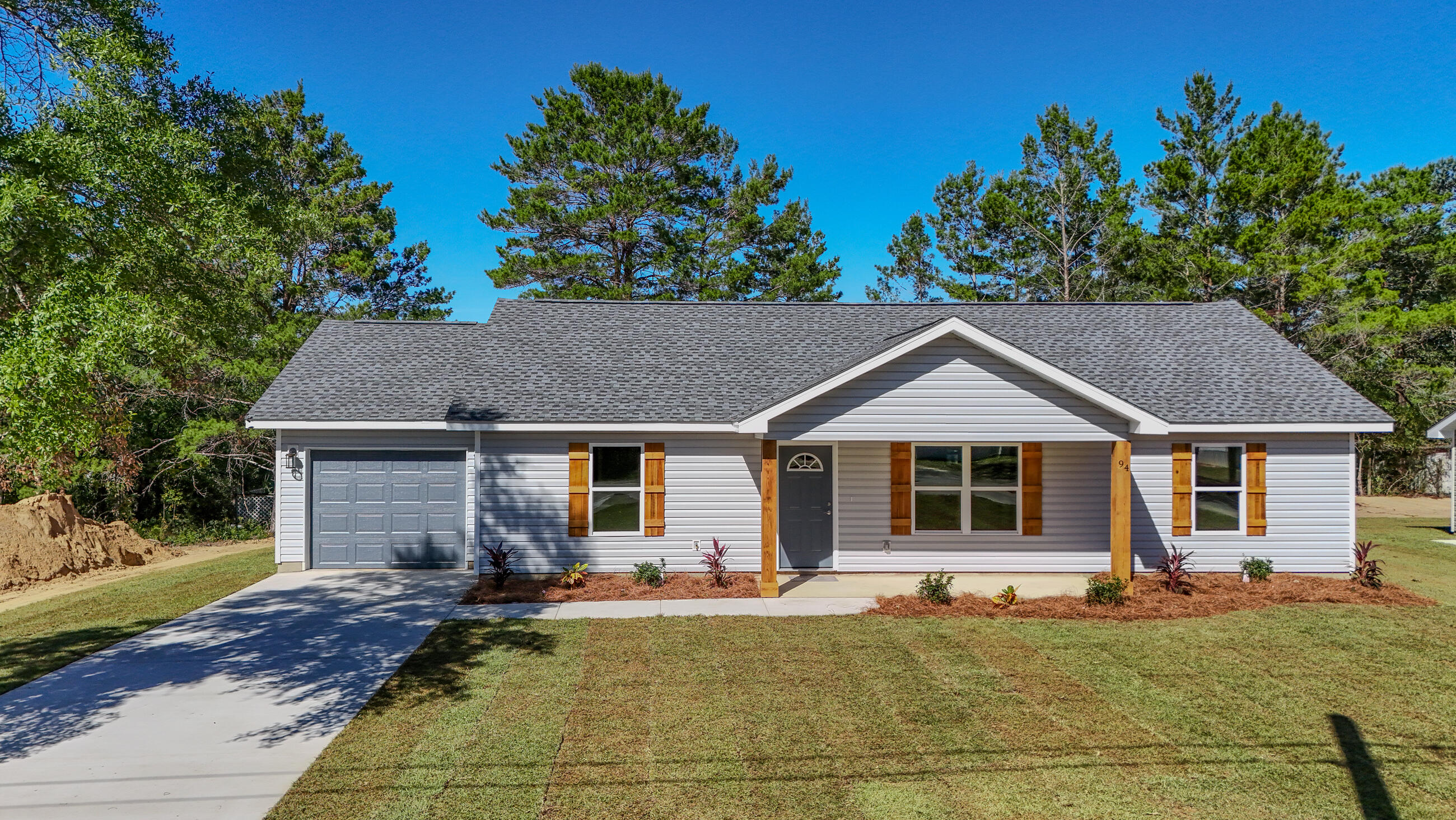 SELLER OFFERING $7,500 TOWARDS BUYER'S CLOSING COSTS!

Construction is COMPLETE and this beautiful new home is MOVE-IN READY!
Built by BA Odom Construction, this brand-new 3BR/2BA home with an attached garage showcases top-quality craftsmanship and a modern, open-concept layout. Features include vaulted ceilings, LVP flooring in the main areas, white shaker cabinets, quartz countertops, and stainless-steel appliances — yes, the refrigerator is included! Enjoy relaxing or entertaining on the back patio, with plenty of yard space to make your own.

Located in DeFuniak Springs, this home offers an easy commute to South Walton, Crestview, Eglin AFB, and Hurlburt Field, and is just minutes from local schools and parks.