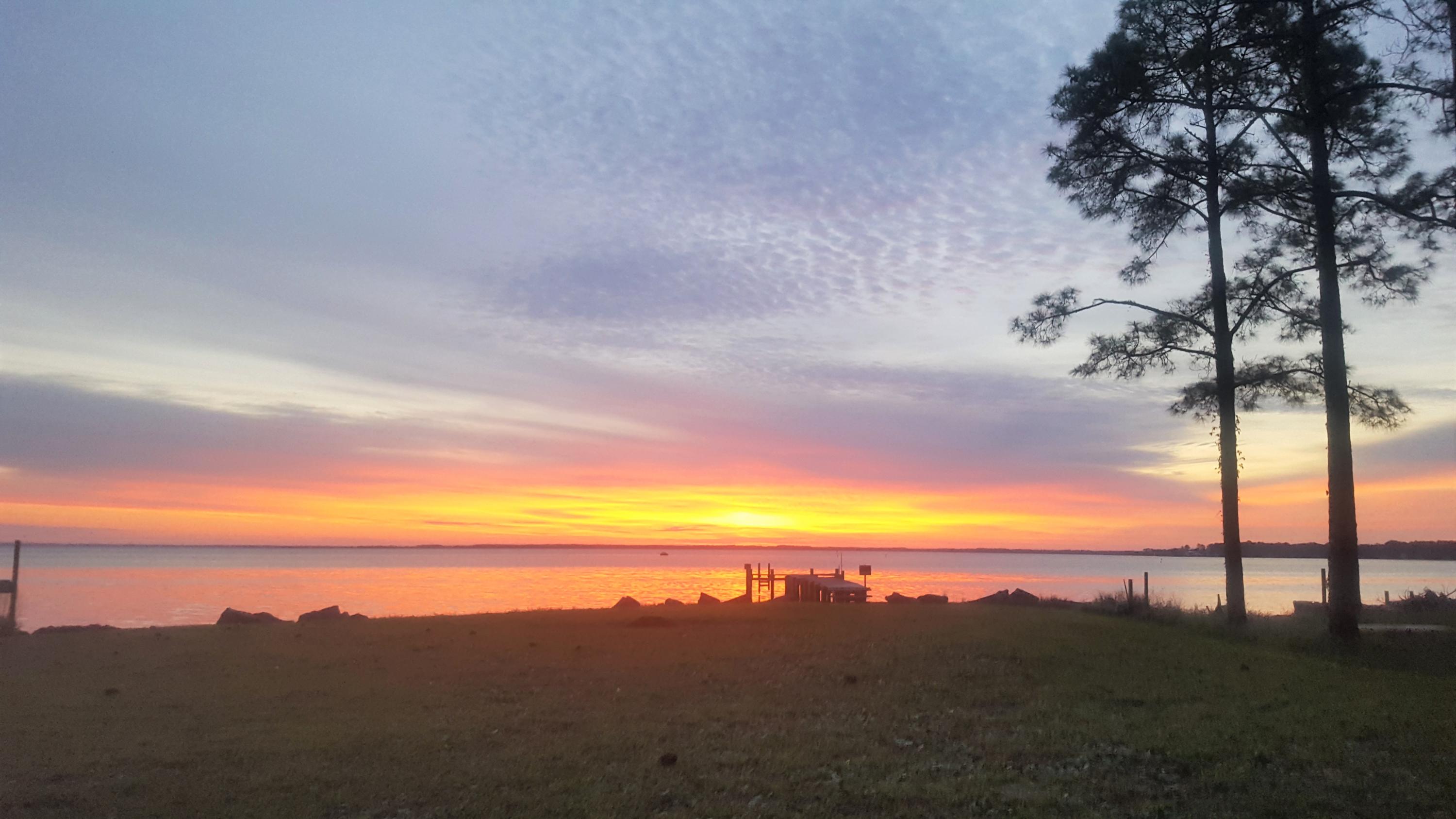 If you dream of building a house on the Choctawhatchee Bay, look no further than 409 Turquoise Beach Dr.  This east facing, 1/2 acre lot offers 180 degree bay views that will take your breath away.  With no HOA, enjoy the freedom to build what you want and when you are ready.  Come enjoy the ''Old Florida'' way of life that living on the bay has to offer.  

Mobile home currently located on the lot is heated and cooled and livable.  It coveys ''as is'' in the sale.