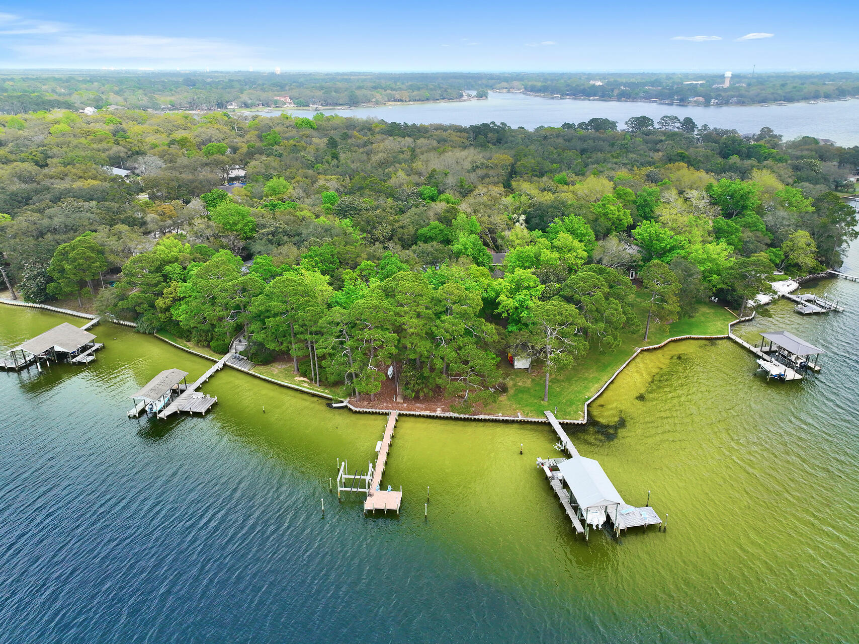 Waterfront rental, close to Eglin AFB, very private setting with western sunsets, 100 feet of water frontage and a boat lift! Pet Friendly Rental!  Non smoking or vaping rental. This executive home features 3 bedrooms, 3 baths, 2452 sq ft and a 2 car garage! Enter the 1.2 acre property by a 435 ft private drive. The driveway opens to a gorgeous home with a covered front porch. Enter the large foyer and there is a separate dining room and a large living room with 9 foot ceilings. The living room has crown molding, built ins and a fireplace. There is a screened 12x68 ft  porch. The kitchen, living room, and primary bedroom have spectacular views of Garniers Bayou. The primary bathroom features  double steam shower, jacuzzi tub, walk in closet, and a shoe storage closet. There are two additional guest bedrooms and bathrooms. The dock leads to a boat lift! Paddle board or fish from the dock or have a cocktail and watch the sunsets over the bayou.