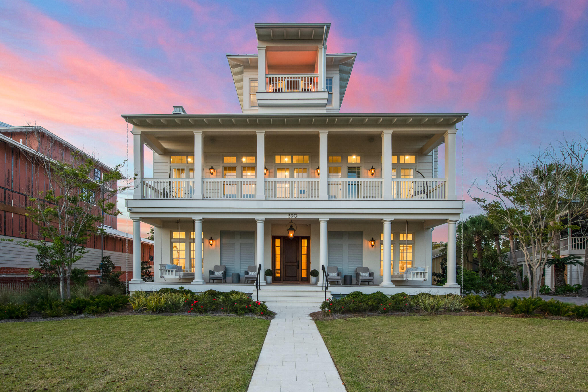 **Back on the market due to Buyers financing.** Home is in great condition with recent inspection.
Welcome to Walton Rose! This exemplary home embodies every bit of the elegance and coastal charm that Inlet beach has to offer. Just a few steps from the sugar sand beaches and neighboring the highly sought after Rosemary Beach, this location is unsurpassed. 5 br/5.5 ba effortlessly accommodates the entire family with the main home and a carriage house. Spanning over 4,500 sq ft, studious detail was taken in the construction of this impeccable retreat, from the natural beamed raised ceilings and neutral hardwood flooring to the state of the art appliances, private elevator and adjacent carriage house. Large windows span across every room, creating a warm embrace of raw luminescence throughout the space. A double car garage provides secure parking along with ample storage capacity and room for a golf cart. Spend an afternoon in your own oasis of outdoor amenities featuring a private pool, fireplace, summer kitchen and putting green. The crowning top floor highlights opulent panoramic sunset views over the emerald Gulf waters that you have to see to believe!

The home next door has been completed.

Information contained within this listing such as square footage, is deemed to be accurate but is not guaranteed. Buyer to verify.