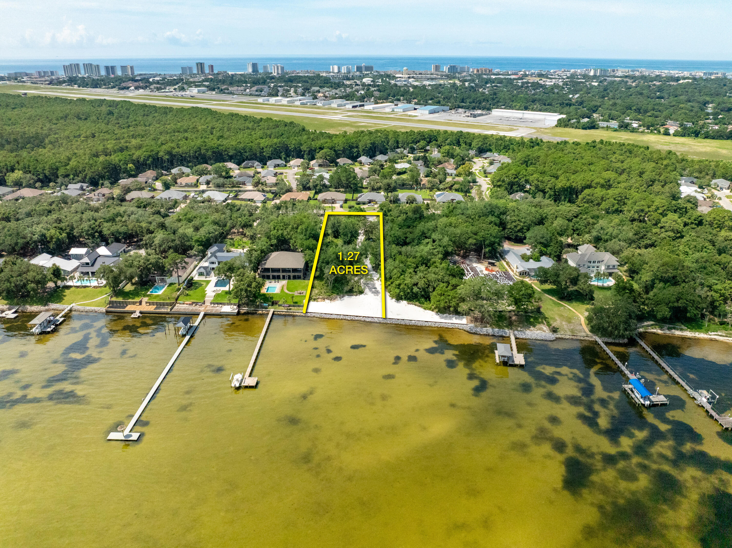 NEW BULKHEAD & SEAWALL ★ NO HOA!  Approximately 1.27 prime waterfront acreage oriented on the scenic Choctawhatchee Bay in Destin, Florida! One of the most impressive, vacant water-front parcels now offered for sale on Indian Trail, encompassing an extraordinary view corridor and vista across the scenic Choctawhatchee Bay. Very few premier, vacant waterfront lots remain in Destin for the custom design and construction of fabulous new residential enclave, especially one of this magnificence! This rare opportunity yields a substantial expanse of ±128' fronting the bay, with boundary depths of ±493' and ±479', West and East boundaries, respectively. The topography and elevation of this phenomenal residential parcel is stunning and thus will offer substantial... savings for the site work involving the development of a custom waterfront compound, perhaps a main home, guest house, and garage.  Please inquire for further details and to schedule a private showing. A boundary survey is uploaded to this listing.
