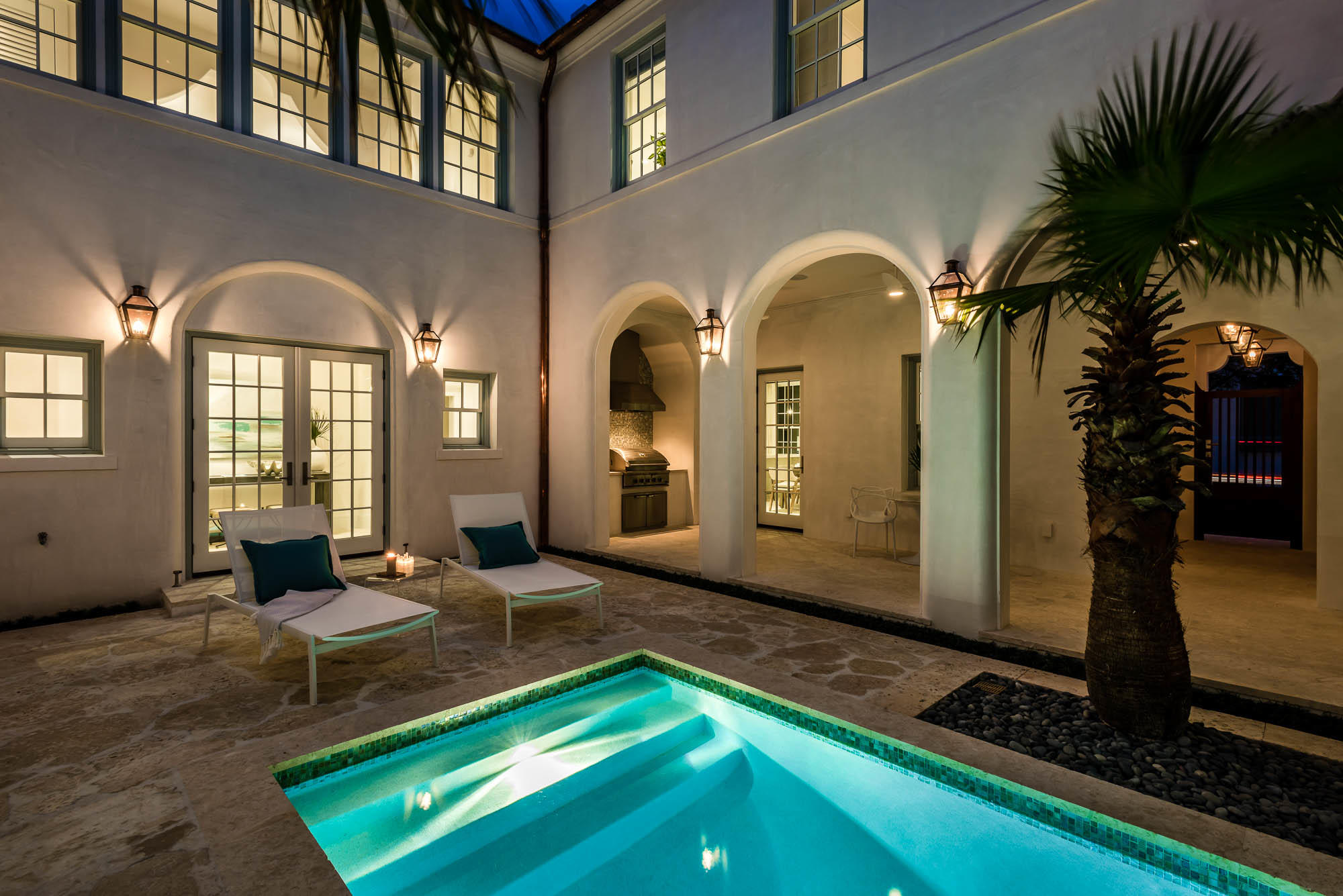 Presenting the newest collaboration on North Charles Street, illuminating the ultimate in Alys Beach courtyard living. Reconnect or disconnect in the harmonious private courtyard retreat, complete with heated pool, fountain, TV and summer kitchen. Interior Design by Urban Grace elevates the easy, sophisticated coastal lifestyle with practical yet, imaginative genius throughout the 4 bedroom, 4.5 bath home. Architecture by Historical Concepts captures classic features that withstand the test of time with details of quiet elegance.
Off the sunny courtyard with shaded loggia, enjoy the open concept Living Room, Dining and Kitchen. Relax by the fireplace and TV gathering area in the serene, texture rich Living Room. Stain resistant fabrics chosen to compliment the beach house vibe. Surround sound and in-wall subwoofers included for a dynamic viewing experience.  Artisan applied Venetian Plaster throughout the entire home creates a show stopping ambiance. The entertaining centric space is accented by oak stained beams and offers a very accommodating dining space for extended dining experiences. A state of the art Kitchen with quartz countertops and Calacatta Gold Marble backsplash, features a Wolf Gas Range, Subzero Refrigerator, warming drawer, Asko Dishwasher and Miele Coffee Maker.  A Butler's Pantry with two zone wine refrigerator, ice maker, quartz countertops and multiple cabinets for storage adds an excellent tucked away spot off the kitchen.  Beach lockers for chairs, sunscreen and towels, create a clutter free zone in the large laundry room, complete with Electrolux Washer, Dryer and sink.  
One of two Master Suites, the first-floor Master Suite overlooks the tranquil courtyard pool and fountain.  Vaulted ceilings are highlighted with stained oak beams and Venetian Plaster. The Master Bath has a custom chevron pattern double vanity with honed Carrera Marble selections for countertop, flooring and entire shower. 
The second floor has two Guest Suites, each with private bath, as well as a stair hall whimsical daybed nook.  Escape to the second-floor Media Room, centrally located and offers AV network streaming, surround sound and in-wall subwoofers. Also installed is the Control 4 whole house automation system with security, ability to control remotely with cell phone, whole home audio, lights, TV and Apple TV in Master Bedroom.  Seven 4K HDTV's and multiple Wi-Fi hotspots throughout the home allow for complete coverage.  Other home features include: Dual HVAC systems which can electronically controlled remotely via smart phone, Rinnai tankless water system, and outdoor shower.
Luxe textures and finishes set the benchmark for the second Master Suite retreat. The light filled Master Bath offers twin vanities with floating mirrors, electronic shades, soaking tub with glass tile accent wall, and a large shower tiled with natural Dominican Shellstone.  Completing the suite is the amazing walk in Master Closet with two additional lock-out closets.