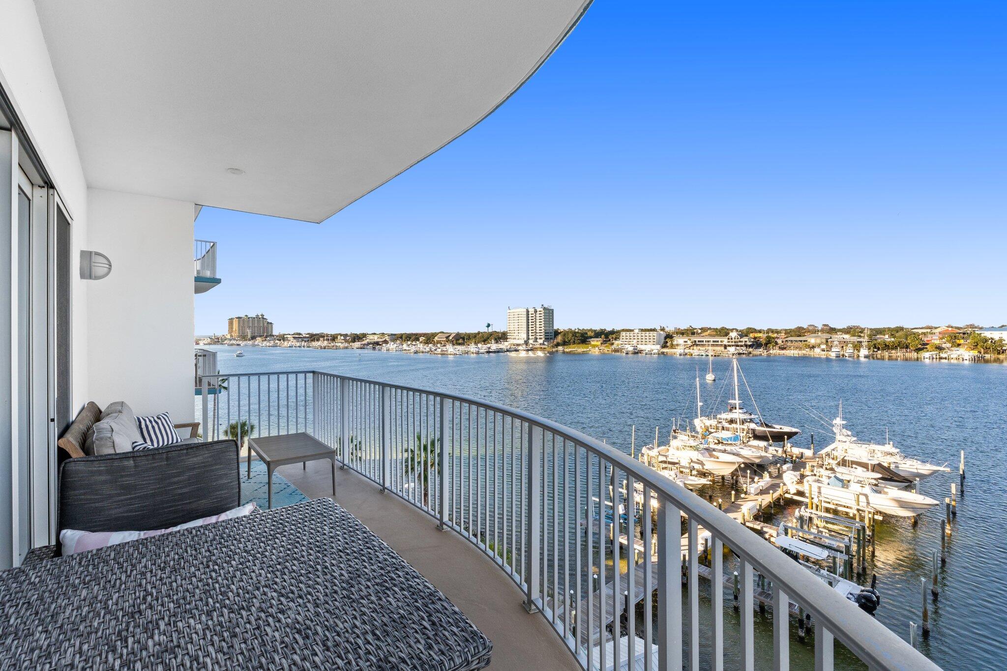 Premier Harbor-Front Condo with Private Beach Access and Luxury Amenities. Experience the pinnacle of coastal living in this 5th-floor, 2-bedroom, 2-bathroom condo at the prestigious Harbor Lights gated community on the Destin Harbor. Boasting 1,390 square feet, this unit offers one of the larger and more thoughtfully designed 2-bedroom floor plans in Destin. Equipped with breathtaking views and modern updates, soak in the sweeping views of Destin Harbor, the Gulf, and the pass from your private balcony. This unit is meticulously updated featuring a beautiful kitchen with custom cabinets, a stylish glass-and-stone backsplash, granite countertops, a single-basin stainless steel sink, and dimmable under-cabinet lighting. Each bathroom is outfitted with designer lighting and elegant finishes. 4" Plantation shutters are found in both bedrooms and the kitchen. Other features include Crown molding in the master suite and living room along with 72" six-speed ceiling fans. As well as LED recessed lighting and a Guardian in-duct air purifier that ensures clean, fresh air throughout the home.

Harbor Lights offers a boutique, low-density living experience with premium amenities including A resort-style pool with harbor views, A fitness center, wet and dry saunas, and a fenced-in dog park. Amenities also include An owner's clubroom with pool tables, foosball, and a grill area, Kayak and paddle-board storage, and a secure lobby entrance with cameras and elevators.

This non-short-term rental community ensures a tranquil and private environment. Enjoy seasonal fireworks, dolphin sightings, the Christmas Boat Parade, and stunning sunsets from your own private balcony. For dining and nightlife, the Destin Water Taxi is at your service, or explore the nearby gated Holiday Isle beach access. Harbor Lights is more than a homeit's a lifestyle. Schedule your private showing today to see why this is Destin living at its finest!