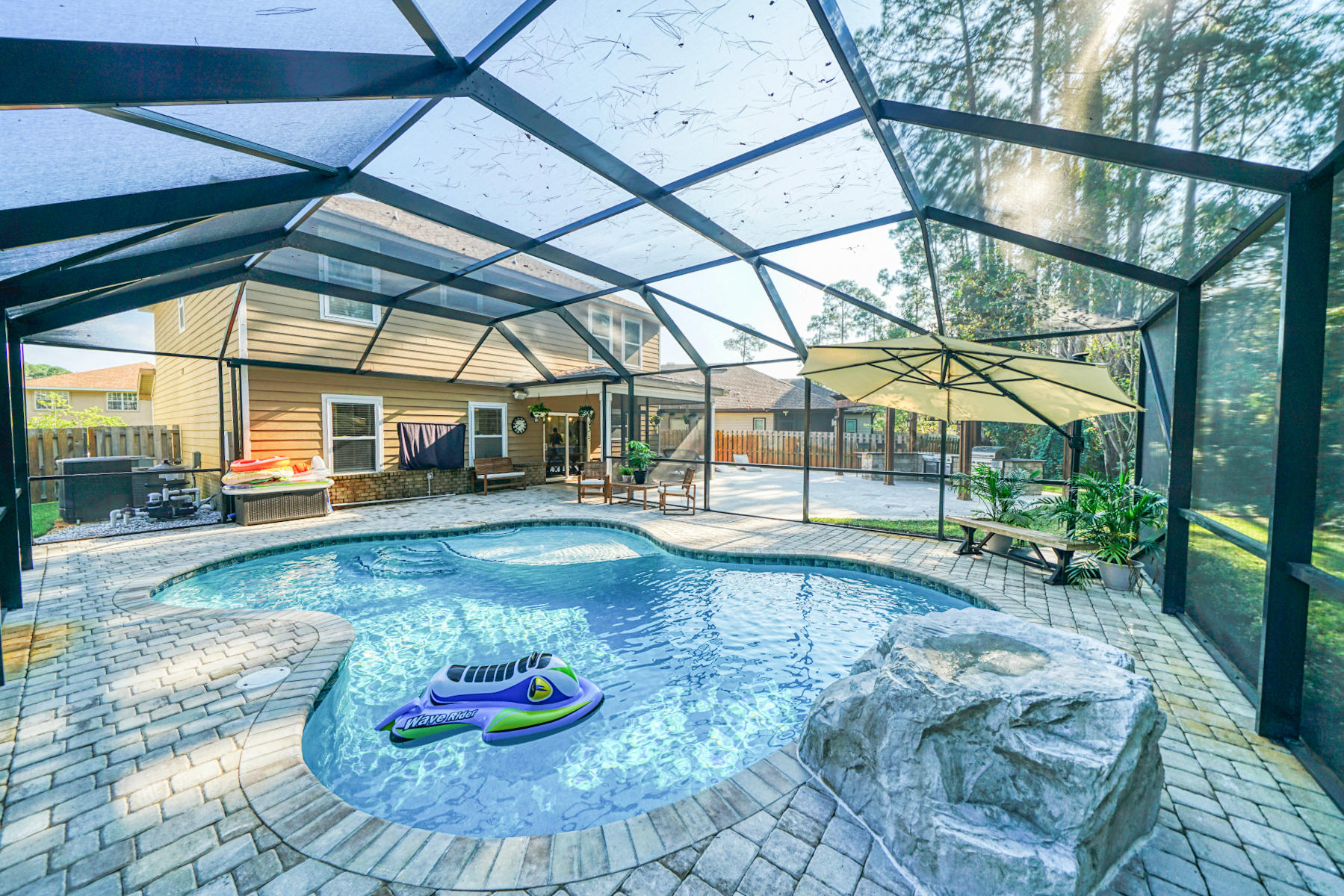 **BACK ON MARKET AT NO FAULT OF THE SELLER** Brand new heated pool - Summer lasts all year long here!  This amazing 5 bedroom home has everything you want and need including an amazing outdoor kitchen and screened in pool with water feature!  New shiplap, lighting, and featuring gorgeous granite throughout, this well thought out floor plan has so much room for everyone.  Roof installed in 2015, Water heater 2015, HVAC #1 2015, HVAC #2 2014, active termite bond with Arrow and is transferable, pool under warranty and transferrable, survey available, flood insurance required but current rate is $600/year.  Buyer to verify all information deemed important.
