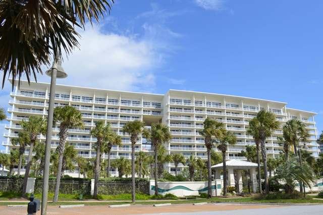 Recently remodeled and turnkey, this elegant unit is a preferred western end unit. The unit has a spacious combined living/dining space and large galley kitchen & laundry room. This living space and the master suite flow out to a large balcony with views of the tropical pool and the lush grounds. This unit has 3 bedrooms/3 baths, which includes a lock-out guest quarters that has a master suite with a large bathroom, walk-in closet, separate entry, and private balcony. This space can be rented separately. The resort offers many amenities: gated community, 42-seat surround-sound private theater, private beachside club with pool and grill, 3400 sqft heated tropical pool, 9 acres of property, 240 ft on the Gulf, aerobics room, high speed internet access & on-site management