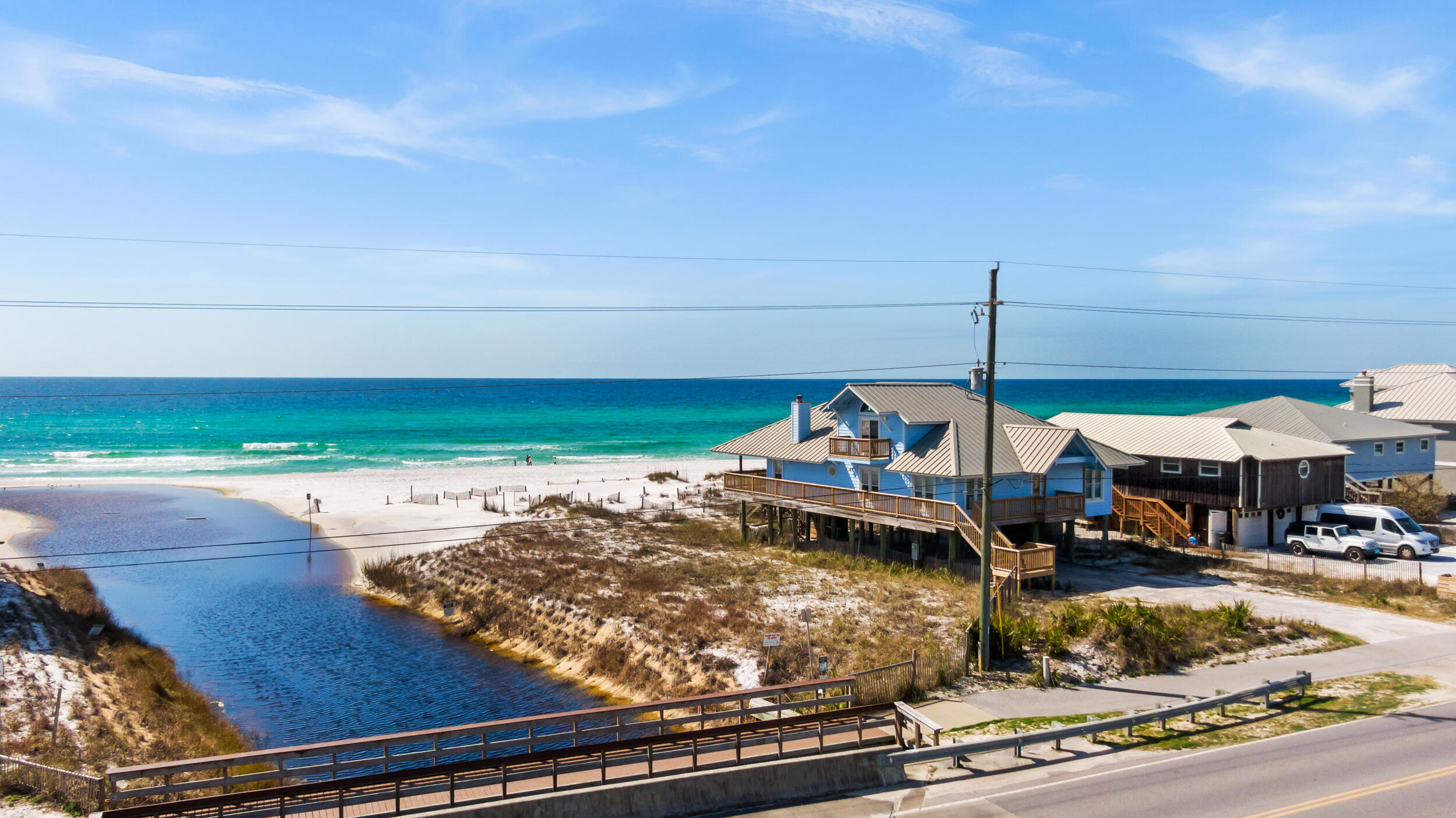 Beach living & panoramic gulf views, on one of the largest non HOA lots on the west side of 30A. Unique two-sided waterfront advantage with oyster lake outfall being available for under ages that need calmer waters. Come view it and call it your beach home! Priced at beachfront comparable lot price. Home listing #917952.

Setback determinations from outfall, gulf, side and roadway have been provided by county and can be provided upon request.
