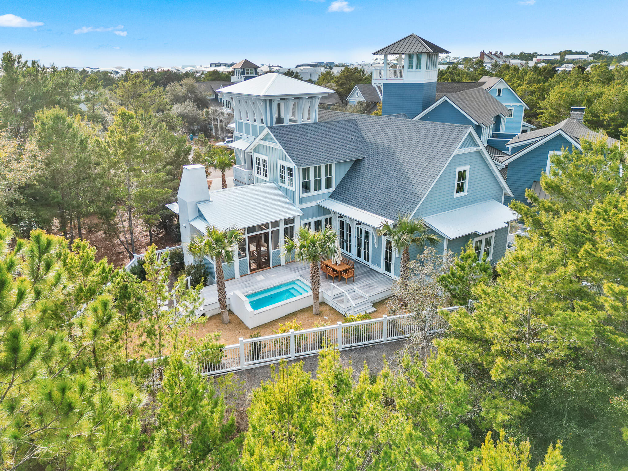 Introducing 80 Shore Bridge Circle, a masterfully crafted coastal residence nestled within the coveted Bridges neighborhood of the gated Watersound Beach community. Tucked away in a private cul-de-sac just moments from the sugar-white sands of Scenic Highway 30A, this home seamlessly blends timeless architecture, refined finishes, and effortless coastal living.
The residence features five generously appointed bedrooms, each with a private ensuite bath, along with five-and-a-half baths designed with both elegance and functionality in mind. The first-floor primary suite serves as a tranquil retreat, highlighted by vertical pecky cypress accents, marble-clad bath finishes, and a spa-inspired ambiance ideal for unwinding after a day at the beach. Upon entry, reclaimed oak hardwood floors, soaring vaulted ceilings, and exposed wood beams create an immediate sense of warmth and sophistication. Venetian plaster walls grace the entire first level, adding texture and understated luxury throughout the open-concept living spaces. Designer lighting and a gas fireplace further elevate the atmosphere, making the home equally suited for intimate evenings or upscale entertaining.
The chef's kitchen is both striking and functional, outfitted with Wolf and Sub-Zero appliances, custom cabinetry, and a wet bar designed for hosting with ease. An oversized laundry room with additional storage and a deep sink adds thoughtful convenience without sacrificing style.
Indoor and outdoor living blend seamlessly, opening to a private courtyard featuring a resort-style pool, enclosed outdoor kitchen with built-in grill, and classic brick flooring. A spiral staircase leads to a rooftop deck- an ideal vantage point for sunset views, coastal breezes, and starlit evenings. Owners also enjoy private community beach access, offering an unparalleled connection to one of the most pristine shorelines in the Southeast.
Additional highlights include dual living areas on both levels, cedar-lined closets, exceptional privacy, and the security of a gated community. Every detail has been carefully considered to deliver comfort, elegance, and peace of mind.
80 Shore Bridge Circle is more than a home-it is an invitation to the Watersound Beach lifestyle. Whether envisioned as a full-time residence, refined second home, or legacy coastal investment, this property represents a rare opportunity along 30A.