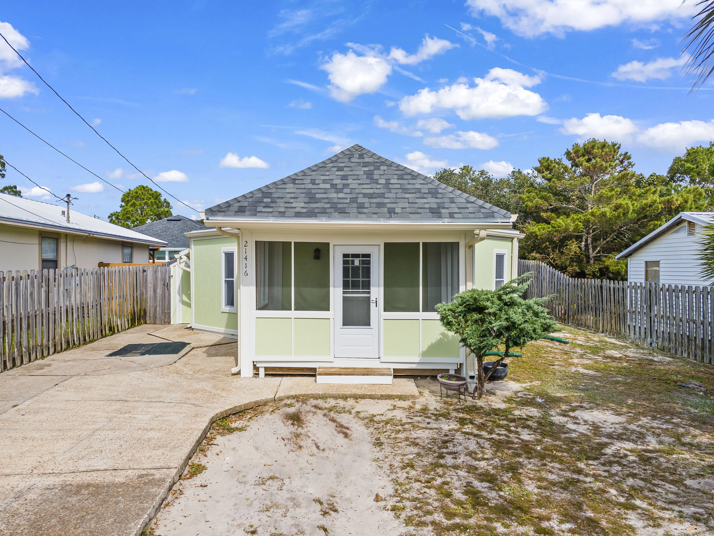 This Cute as a button little beach bungalow on the West end of Panama City Beach is a must see!  When you enter you'll see the high cathedral ceilings with exposed beams in the living room. Travel on to the bedrooms and you'll notice the original tongue and groove wood ceilings. Kitchen has a breakfast bar and pantry for added storage. October '20 Freshly painted interior and exterior & New Roof.

This property is situated new the wonderful amenities of Florida's beautiful Emerald Coast. Close to shopping, entertainment,  and the beachside communities of Rosemary, Carillon, and Alys Beach. It's strategic location makes this a great started home or short term rental. 

Seller is offering a One Year Home Warranty.