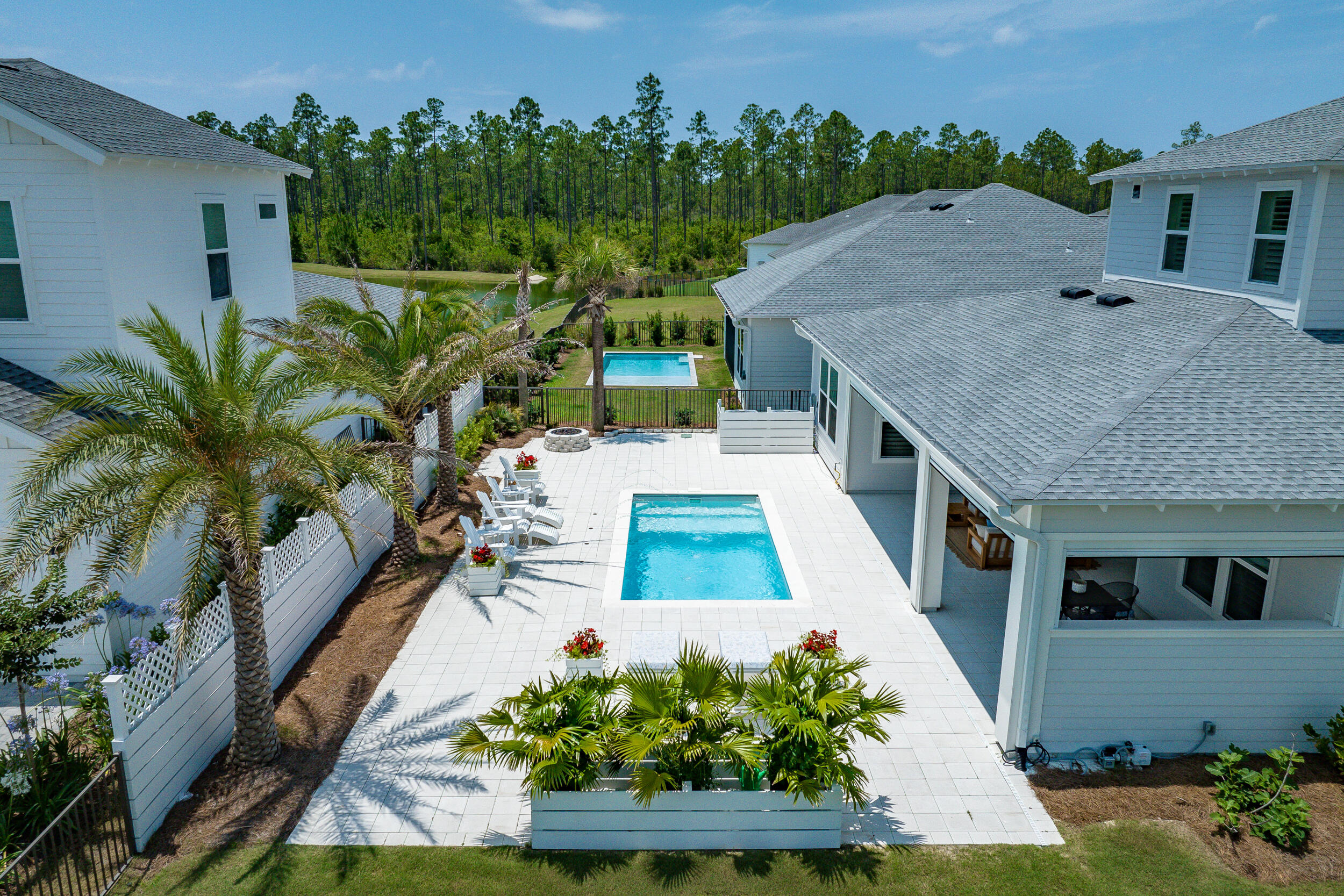 Experience the pinnacle of luxury living at 419 W Lafayette in Naturewalk at Origins, where sophistication meets unparalleled comfort. This soon-to-be-phased-out Venice plan is situated on the largest available homesite, providing extraordinary space and privacy. Families will appreciate the zoning for the highly sought-after Dune Lakes Elementary school. The residence is brimming with custom extras that elevate its charm, from the expansive fenced and gated side yard—complete with a cozy gas fire pit amidst lush landscaping, ideal for intimate gatherings or serene nights under the stars—to the specialty plunge pool with captivating water features and motorized privacy screens on the lanai for ultimate outdoor enjoyment. Don't miss the virtual tour in the listing below to explore this stunning property and all it has to offer.
As you indulge in relaxation, enjoy the seamless integration of speakers wired to the media room, ensuring every moment is accompanied by your favorite tunes.
Inside, culinary enthusiasts will delight in the gourmet kitchen, featuring Silestone quartz countertops with waterfall edges, a 36" gas range with French door Cafe convection oven, an Advantium microwave/oven, and built-in wifi appliances including a fridge and beverage fridge. A spacious pantry with a glass door adds convenience, while the adjacent laundry room boasts a pet/foot wash for added practicality.
The living room exudes sophistication with a natural gas Panorama fireplace, adorned with a custom Silestone wrap-around hearth. A custom recessed tray ceiling with lighting adds a touch of elegance to the space. The primary bedroom on the first floor is a sanctuary of relaxation, showcasing custom herringbone v-groove stained accent wall, a Japanese soaking tub, and a wifi-controlled smart spa shower. Additional features include a makeup desk and a Sunlight infrared sauna, accompanied by a spacious walk-in closet.
This smart house is equipped with Nest thermostats, Alexa in-wall switches with speakers and intercom, My Q garage doors, cameras, and USB outlets in bedrooms set to bedside table height, ensuring convenience and efficiency at every turn.
With two bedrooms downstairs, including the primary suite, and three additional bedrooms, three full baths, a loft area, and a media room upstairs, this home offers ample space for multi-generational living or hosting guests in style.
Beyond its exceptional features, this home is meticulously curated with wallpaper accents in the dining room and first-floor bath, a brick entryway, and a three-car garage. With a focus on luxury, comfort, and maintenance-free living, 419 W Lafayette is a true estate, designed with the finest and most innovative products on the market.