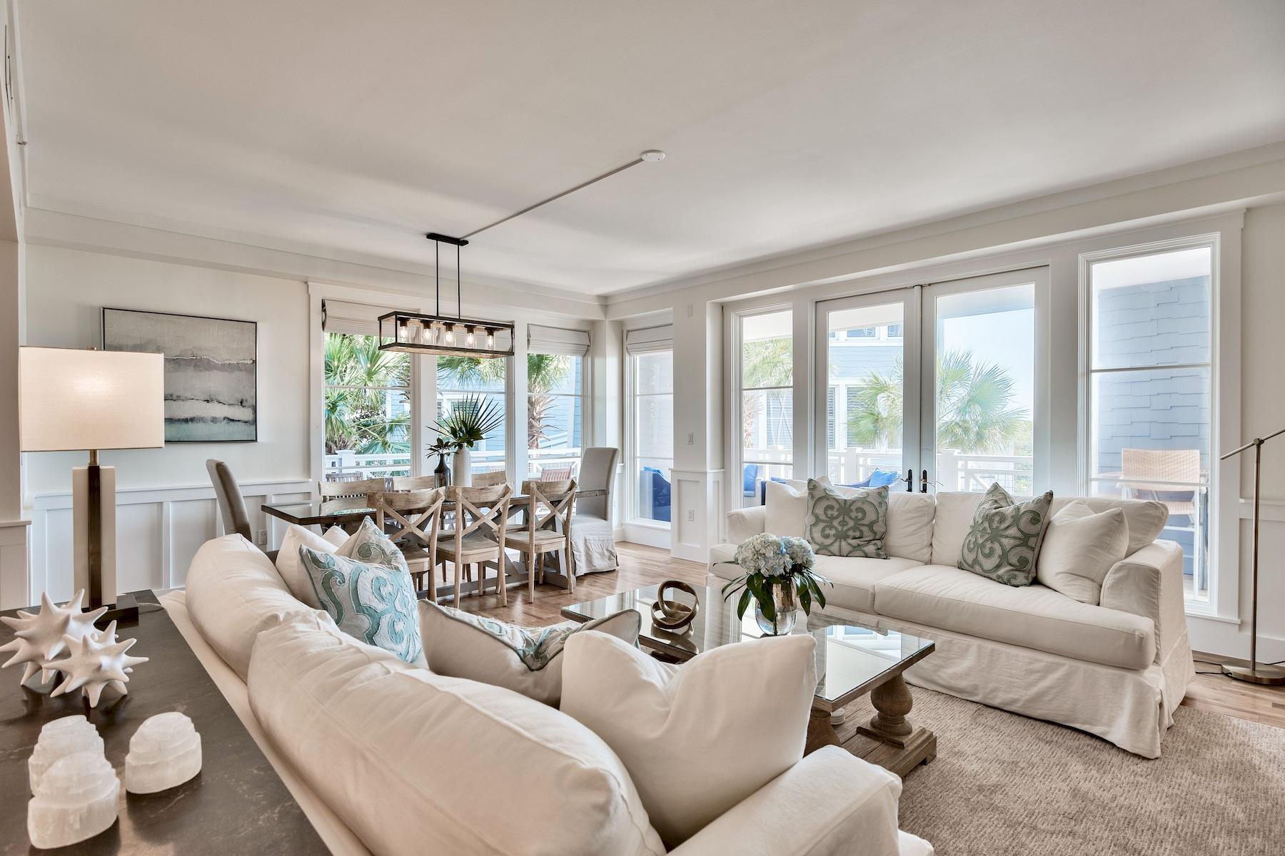 If you're torn between the spaciousness of a beach house but love the convenience of a condo, this stunning residence in The Crossings at WaterSound could be the perfect blend of both. Spread over two levels, this 2,812 sq.ft. unit really does have space for every indulgence. Four beautiful bedrooms and 4.5 bathrooms provide ample space for family and friends and the formal dining area makes entertaining a cinch. The generous open-plan living space with full-height windows provides an airy ambience, bringing the outdoors in. Wood flooring and tasteful decor by Dwell Interiors create a contemporary atmosphere for relaxing and enjoying life. Wide shady porches on both levels provide space for quiet contemplation of the glittering Gulf waters from a comfy chair. In the heat of the day, or on cooler evenings, dual aspect windows create an intimate space for informal dining or chatting with friends over a glass of wine. Visit the nearby Fitness Center for an early morning workout and enjoy Puttering Park or the children's playground. It's all part of the comfortable laid-back lifestyle that WaterSound Beach nurtures. Neighborhood pools and clubhouse amenities provide as much socializing as you wish for and just a short walk through the dunes brings you to the stunning white sandy beach.