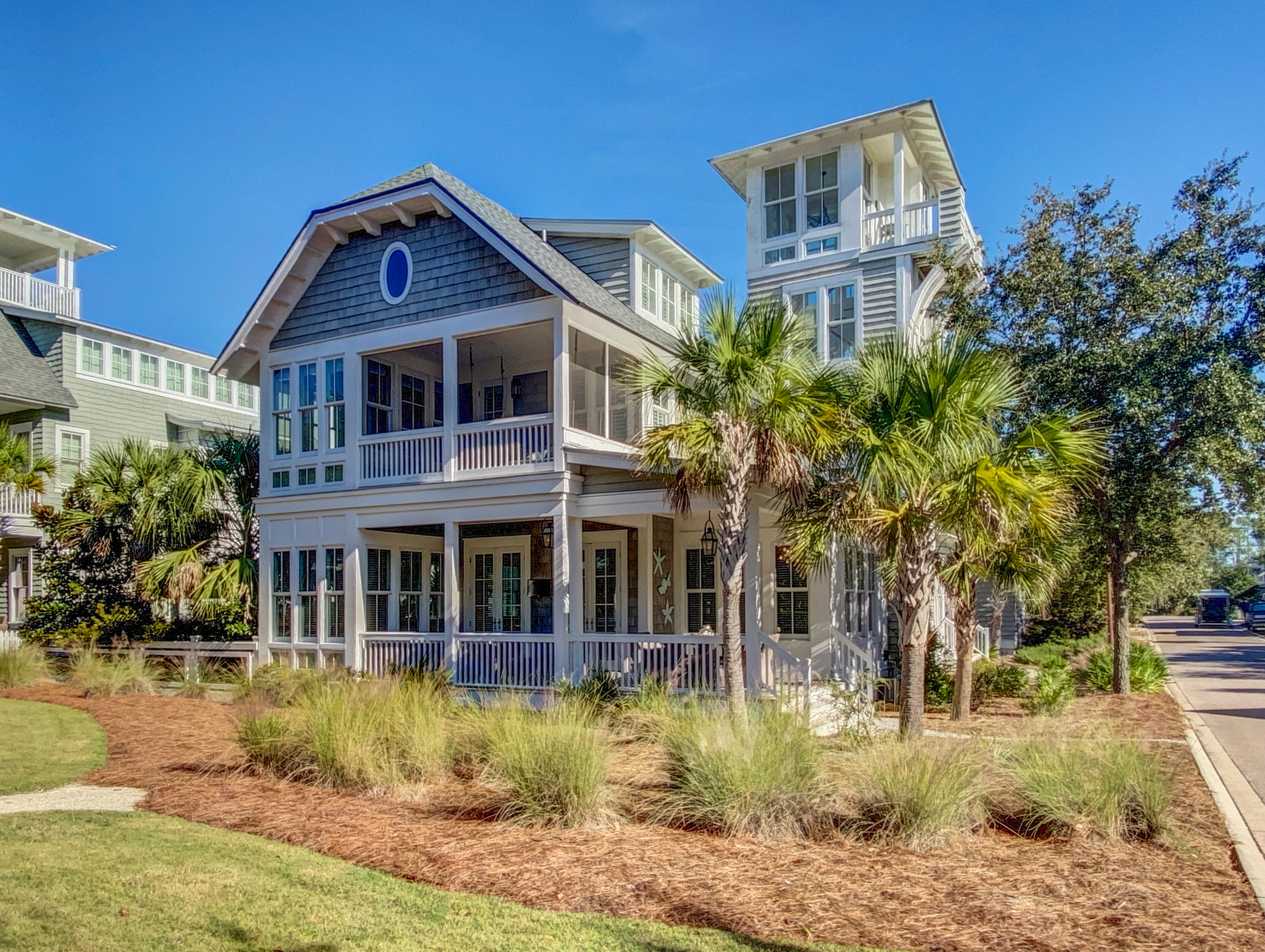 A statement-making, yet intimate house, with a stunning interior, just right for entertaining or hiding away. The 4281 sqft elegant residence blends timeless beauty with modern-day amenities. Gracing a large corner lot, the spacious 5 bedroom. 5.5 bath, home is designed to fully enjoy all the Watersound Beach offers, with the large open concept living area transitions to the outdoors in true coastal fashion including the backyard with heated pool and outdoor dining area, where an outdoor kitchen and fireplace await.
This special residence is offered fully furnished and highlights open interiors flooded with natural light, and its professionally designed interiors display high-end upgrades inclusive of an entertainer's kitchen: Thermador appliances, leather treated countertops and complimenting backsplashes, center island, two dishwashers.  The entire house is accented with the highest quality finishes by Jennifer Suddes of Atlanta's Magnolia House Design Group, including reclaimed ceilings in areas throughout the home and complimenting the tongue and grove accent walls.  A dedicated sitting room hosting a serene master retreat with relaxing sitting area and bath suite with deep-soaking bathtub, large shower, and custom tile work.
On the upper floors you will find three more bedrooms with walk-in closet and full bath. The third floor completes the suite of bedrooms with an oversized bunkroom which sleeps 12 and includes a media area for movie nights and private bath.  Additional amenities to the home include reclaimed hardwood flooring, tankless water heaters, multi-room audio system, designer lighting, plantation shutters in bedrooms, second level bedswing, and one car garage.
Enjoy all of this among the exclusive luxuries and amenities of WaterSound Beach, just a stone's throw from the world-class beaches and a short Golf cart or bike ride away from award-winning restaurants, shopping and more.