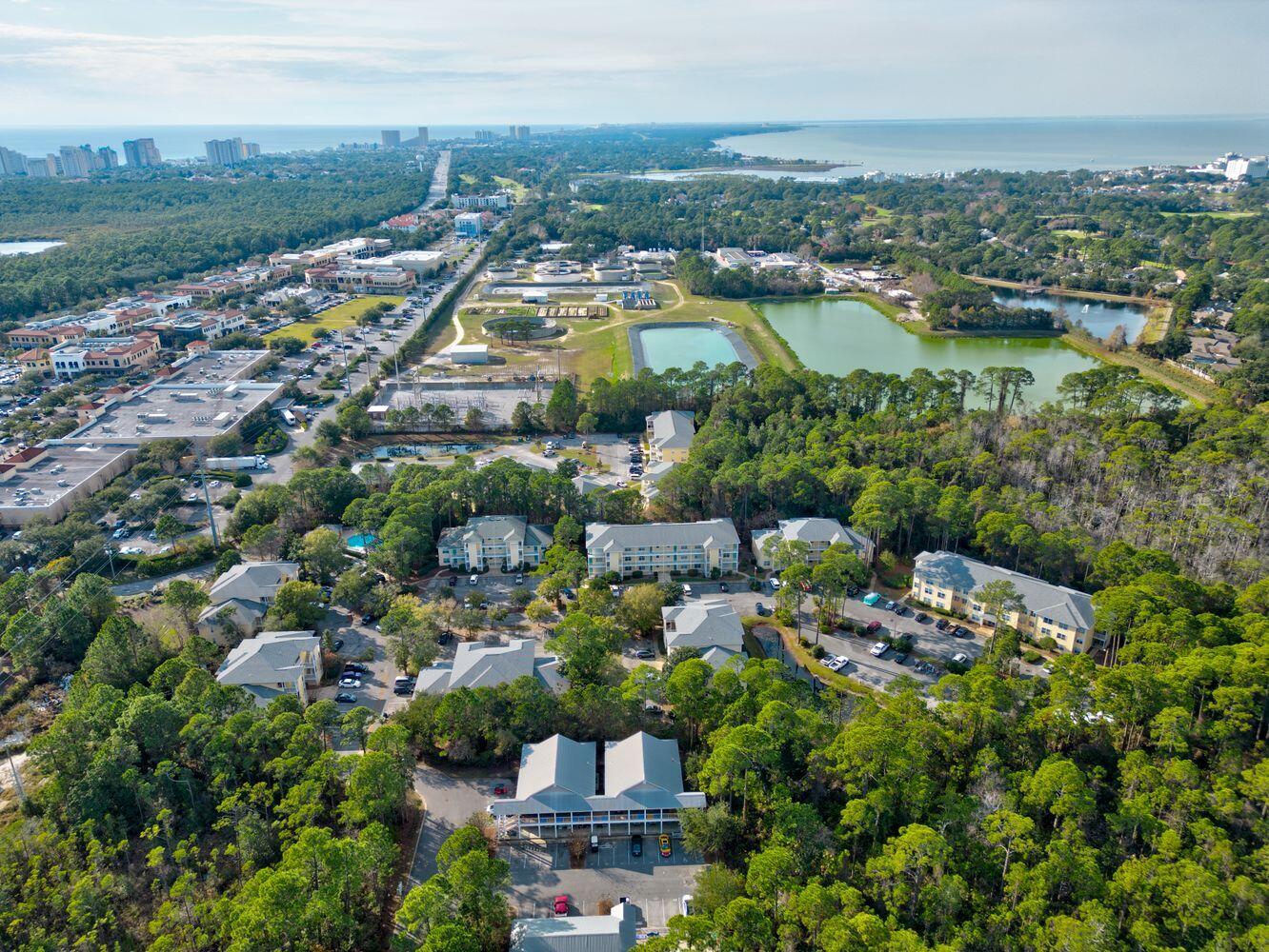 Welcome to coastal comfort and investment potential! This charming 2-bed, 2-bath condo is nestled in the Pointe of View community in Miramar Beach, FL, offering a rare blend of affordability, location, and flexibility. Located on the second floor, this unit features wood-look tile flooring throughout, a newly installed kitchen sink, and a spacious in-unit laundry room... making everyday living and maintenance a breeze.

Fully furnished and turnkey ready, the home sleeps 4 comfortably, with a king-sized bed in the primary suite and two twin beds in the guest room. Step out onto the private balcony overlooking a serene wooded preserve... perfect for morning coffee or evening relaxation. Whether you're seeking a vacation rental, long-term investment, or full-time residence, this unit checks all the boxes.

Enjoy nearby access to Grand Boulevard, Publix, Starbucks, dining, shopping, and Sacred Heart Hospital... all within minutes. Love the beach? You're just a short drive from the stunning shores of South Walton and Sandestin public access points. The Pointe of View community also features a swimming pool, fitness center, and allows gas-powered golf carts, offering convenience and lifestyle perks not found elsewhere at this price point.

Water heater and HVAC are approximately 5 years old, ensuring peace of mind for investors and homeowners alike. No assigned parking, but plenty of available spaces.

Don't miss this opportunity to own a piece of paradise with proven rental income and unbeatable access to everything Miramar Beach has to offer. Schedule your private showing today!