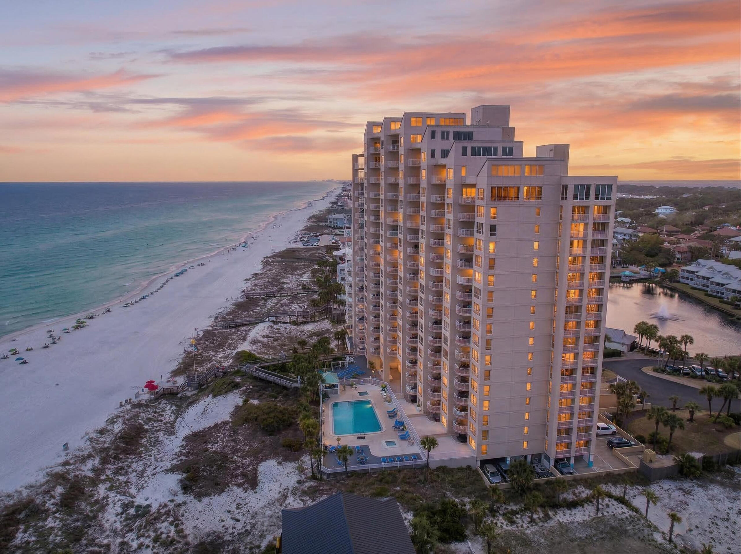 Professional photography soon! Beautifully updated 2BR/2BA Gulf-front condo in Gulfside at Hidden Dunes Beach & Tennis Resort, a 27-acre gated beachfront community with 24-hour security ideally located between Destin and 30A. Positioned on the 4th floor, this unit offers the perfect ''sweet spot'' elevation with unobstructed views of the emerald Gulf waters and sugar-white sand while still overlooking the resort's lush landscaping and pool. Offered fully furnished and rental-ready, this turnkey property features an open-concept living area filled with natural light, a well-appointed kitchen with granite countertops, stainless steel appliances, and breakfast bar, plus an expansive Gulf-front balcony. The primary suite enjoys Gulf views, balcony access, and an ensuite bath with double vanities and walk-in shower. Gulfside amenities include a private beachfront heated pool, hot tub, kiddie pool, fitness center, gated beach access, EV charging, and covered parking. Resort amenities include tennis, pickleball, pools, tram service, and more. Excellent investment or second home opportunity.