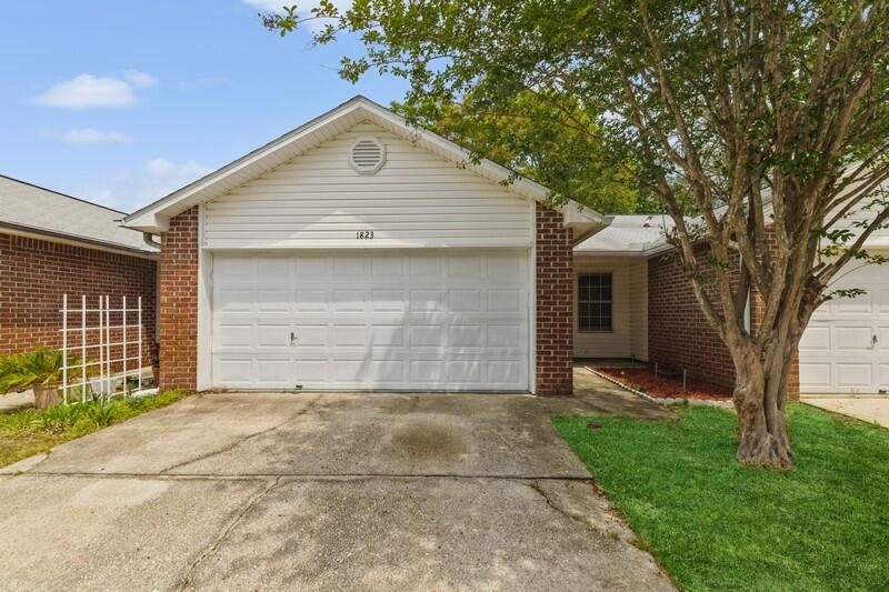 Single-story townhome with a 2-car garage in Fort Walton Beach! Very well maintained 2 bedroom, 2 bath home features a open living/dining combo connected to a galley-style kitchen. The bedrooms are spacious and the master bathroom has a large double vanity. The oversized garage houses the washer/dryer hook-ups. The guest bedroom has an exterior door to a small  open yard  buffered by a small wooded area (very peaceful).  This property would make the perfect starter home, retirement home, or rental!