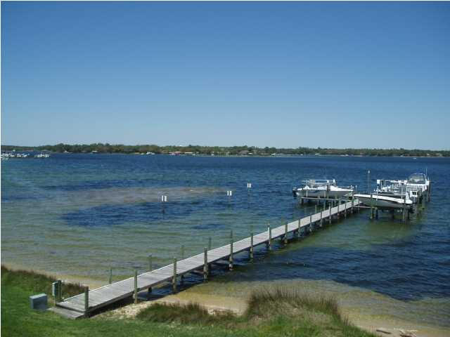 What a view to wake up to! This is waterfront town home living at its finest. This home is ideally located on a quiet street with breath taking views of Garniers Bayou. Just minutes away from Eglin Air Force Base, Hurlburt Field and shopping. You will be amazed with the amenities this home has to offer from the tile floors, cathedral and vaulted ceiling and built-in china hutch. The kitchen has side-by-side refrigerator, built in microwave, pantry and a breakfast bar. Living room/dining room combo but the dining area is very spacious for that person who has the large table and want keep the leaf in it you can! There is plenty of room here. Upstairs are three large bedrooms and the spacious Master suite where the ceiling is vaulted and again there is a wonderful view of the bayou. No smoking. No pets.