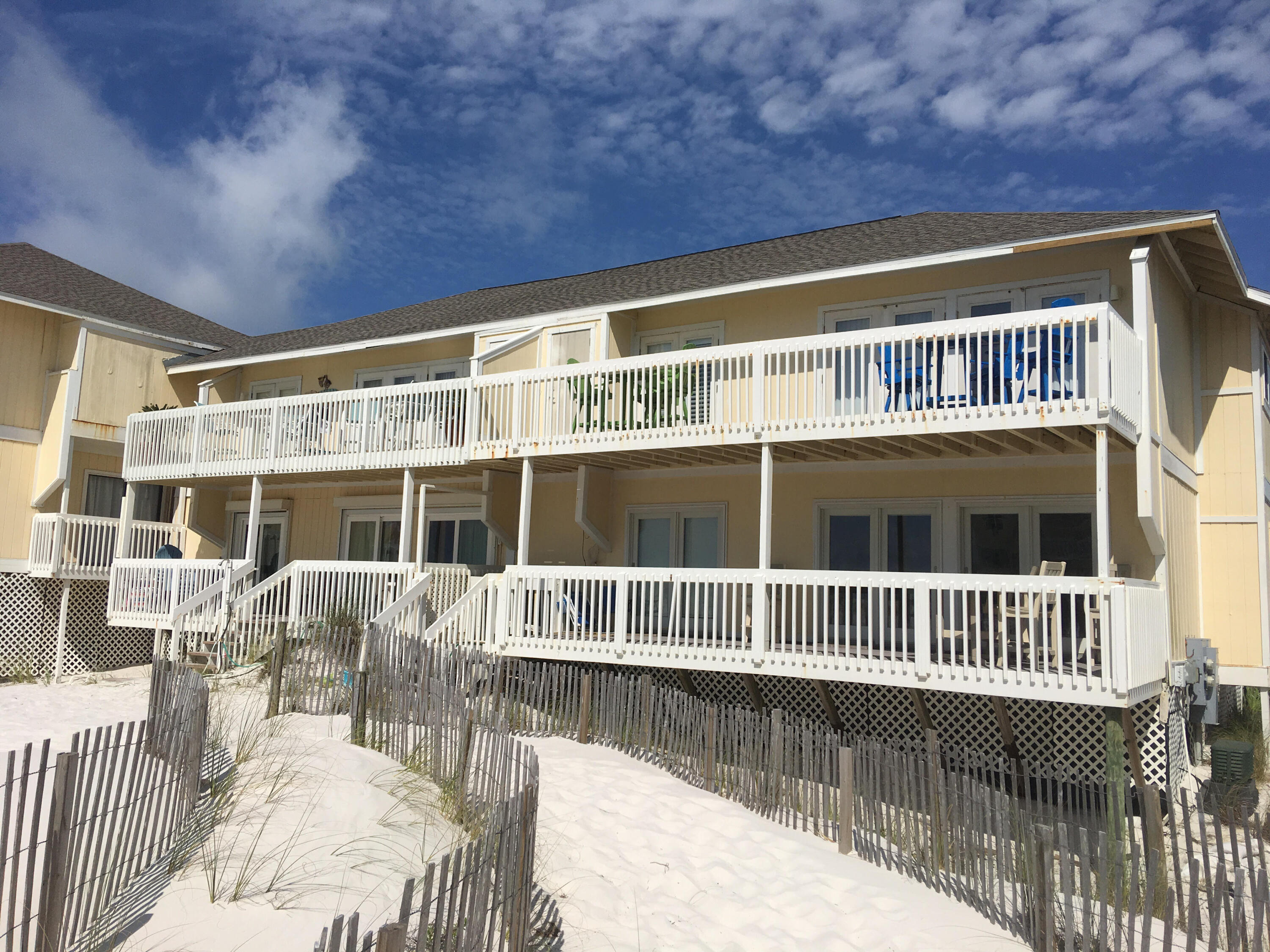 As soon as you leave the deck of this lovely beach condo you will be in the sand. Updated flooring and stainless appliances make this condo pop. Plenty of room for the whole family and you can also take advantage of the lucrative rental market. Many great amenities include tennis, executive golf course, onsite restaurant, and there is even a marina. Many fun attractions in the area. Buyer to verify all information.