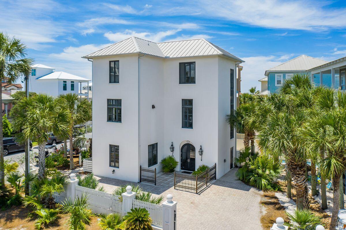 Endless memories and enchanting views abound from this ideally located three story beach home nestled along one of the most walkable stretches of Seagrove Beach. Impeccably maintained, this three-story property offers a crisp contemporary coastal design, an open and air floorplan, and spacious outdoor spaces, sure to delight discerning property buyers. Sitting three tiers off the sugar white sand beaches south of 30A, convenience is paramount with an elevator transporting throughout all three levels, with three bedrooms on the main level and a reverse concept living-kitchen-dining space on the second. The top floor is an encapsulating owner's retreat offering a private living space as well as an oversized ensuite for the ultimate in privacy and relaxation. Forever views are gifted from the top level balcony, while a private beach access to the west provides uninterrupted transport to and from the beach. 

A private courtyard inspired pool and fire pit area offer outdoor entertaining spaces, while plentiful parking is made possible by the oversized, paver driveway. Viking appliances ensure that upscale quality was top of mind during the home's design process, while timeless finishes provide a refreshing palette easily adaptable to a new owner's vision.