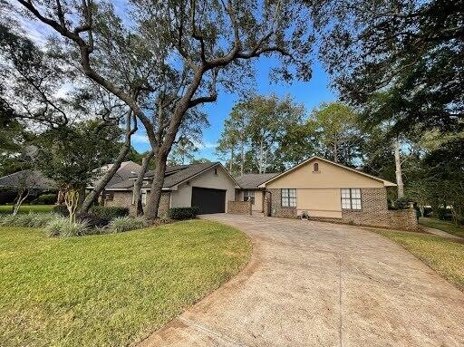 Lovely 3 bedroom, 2 bath home in the highly desirable Bluewater Bay. This home features an open floorplan with vaulted ceilings. The spacious living room boasts a brick fireplace, recently converted to gas. The large, updated kitchen features stainless-steel appliances, granite countertops, a modern backsplash with LED under-cabinet lighting, and a large breakfast nook. There is also a formal dining room, as well as a Florida room overlooking the spacious backyard. Out back there is an open patio for entertaining that looks onto the golf course. The primary offers a walk-in closet and its own patio access, as well as an en-suite complete with a garden tub, rain shower head, and a double vanity. Guest rooms are nicely sized and share a full guest bath. 2-car garage. Washer/dryer available for purchase. Pets may be considered on case-by-case basis with prior owner approval and a non-refundable pet fee. No smoking, including vapes. Lawn care included!