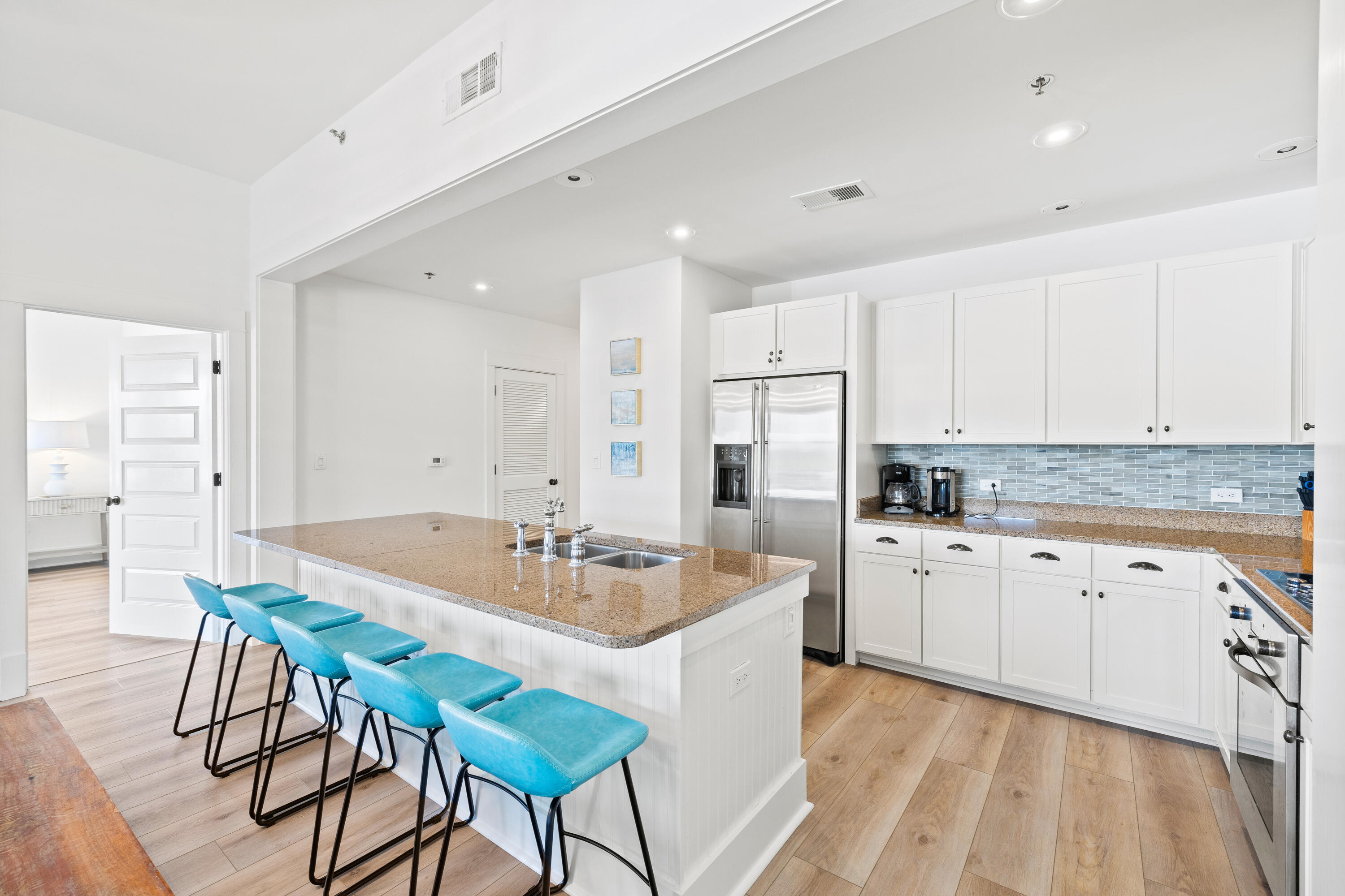 Rare opportunity to own a top floor corner unit in the highly sought-after Redfish Village! Freshly painted, this 3 bedroom 3 bathroom condo offers an open layout highlighted by newly laid waterproof LVP flooring. The owner has spared no expense with recent updates including a renovated master bathroom, new kitchen backsplash, contemporary light fixtures and newer furnishings complimented with smart TV's in each room. Once outside on the oversized balcony, you will immediately realize the privacy this unit provides with its corner position offering sunrise views over Big Redfish Dune Lake. A proven income earner, unit M2-414 is being offered fully furnished and turnkey with rental income projections exceeding $50,000 annually. Situated in the heart of Blue Mountain Beach, Redfish Village is steps away from shopping, dining, entertainment and the sugar white sands of the emerald coast beaches. Amenities include a large resort style pool; private beach access with beach service, parking, bathrooms and showers; a lake side dock; owner's lounge, fitness center, playground; outdoor grilling area and covered parking.