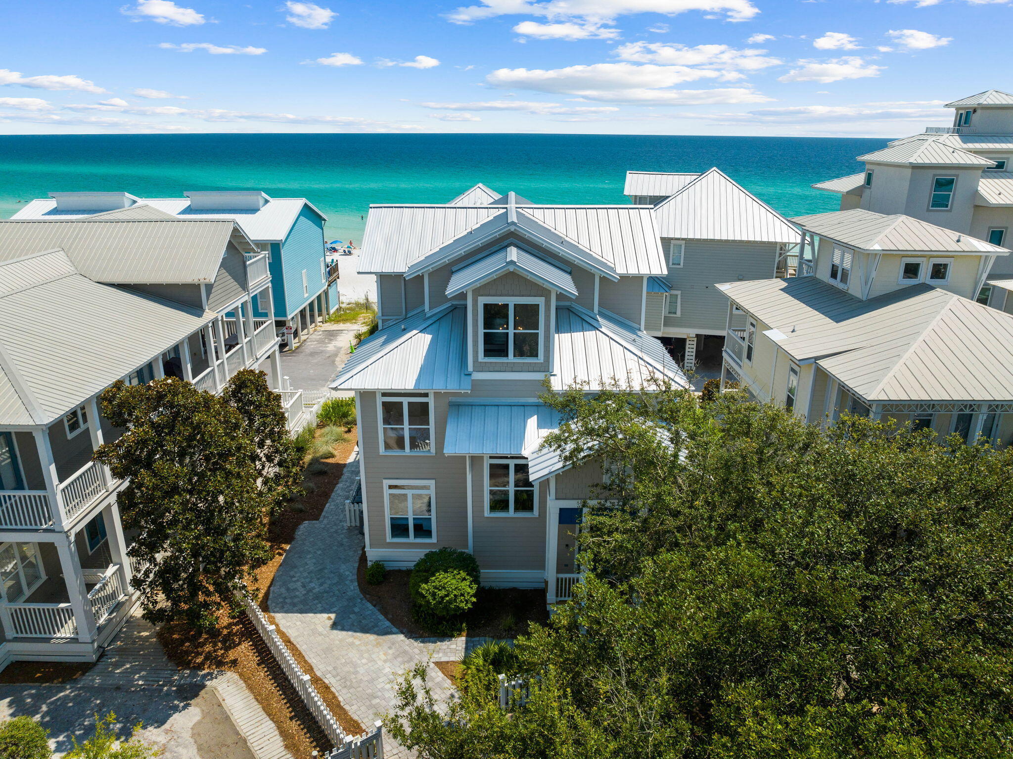 Prominently positioned to embrace the stunning views of the turquoise hued waters throughout the newly remodeled floorplan spanning three floors and over 3,000 square feet, 67 S Ryan Street stands as a timeless masterpiece of elegance and coastal luxury with a modern flair. A unique collaboration between idMI Designs and Ray Jackson Construction, the expertly curated floor plan showcases soaring ceilings, ample outdoor living space, and high-end finishes throughout.
 
Designed for entertaining, the culinary kitchen features custom cabinetry, an extended island, six-burner gas range, Sub Zero refrigeration, and a professional grade appliance package. Providing a seamless continuation of entertaining space, the covered porch is the perfect place to grill out and enjoy a meal or gathering while admiring the views out to sea contrasted by the sugar white sand and anchored by the soothing sound of the rolling waves. The Gulf views are carried throughout the adjoining living room boasting beautiful tile, a fireplace, and chic furnishings. A junior suite with ensuite, dining area and powder room complete the first floor.
 
Situated on the second level, the primary suite is paired with ample space and a spa-like ensuite encompassing dual vanities, a custom tiled wet room, soaking tub, and a walk-in wardrobe. Two additional guest suites, each complete with a dedicated ensuite and a laundry room are also found on the second floor.
 
Perched atop the third floor, the secondary living area with expansive covered porch and junior suite provide the perfect place to gather and entertain while admiring the unique palate of mesmerizing hues and colors provided by the famed Emerald Coast sunsets each and every night.
 
Notable features from the recent remodel totaling over a half a million dollars include a newly installed roof, HVAC system, water heater, flooring, plumbing fixtures, electrical fixtures, interior and exterior painting, furnishings, and appliances. The parking arrangement provides ample space with accommodations for four vehicles with dual parking pads in addition to the driveway. There is also a rear access in the backyard to get to the private beach access which is just a couple feet away. 
 
Tucked away on the South side of Scenic Highway 30A, the sought after community of Summer's Edge is vibrant and family-oriented. The community affords residents with an array of amenities including deeded beach access, walking trails with sidewalks, and two Gulf-side pools.  The culmination of luxury and exclusiveness creates an intimate setting while remaining geographically poised near all the acclaimed dining and entertainment 30A has to offer. Impressive rental potential with annual revenue projections exceeding $250,000 coupled with the furnished and turnkey configuration makes 67 S Ryan Street a compelling opportunity for both investors and full-time residents alike. Schedule a private viewing today and start living the coastal lifestyle you deserve.