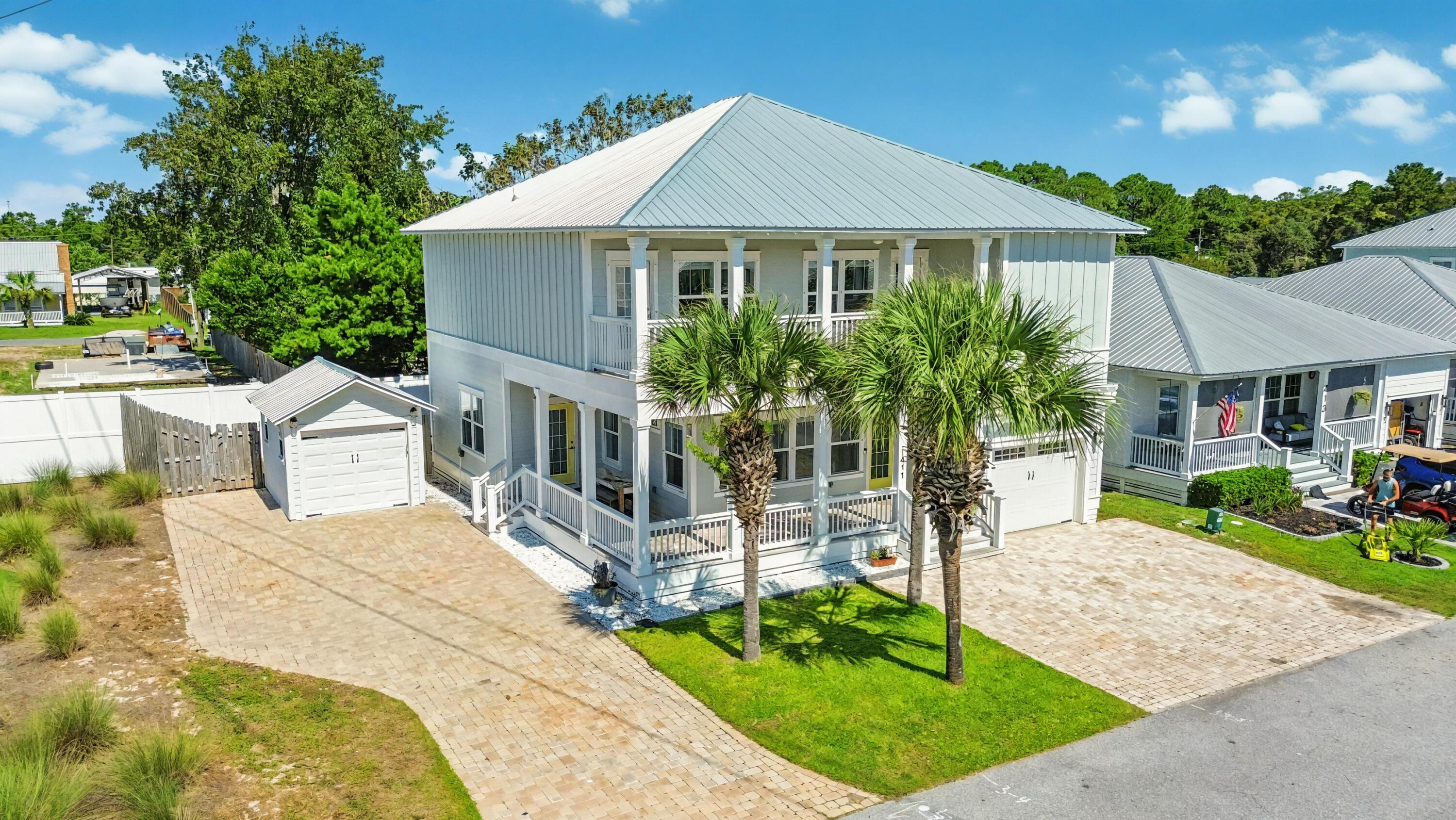Assumable Loan at 2.75%!!! Welcome to Paradise, where coastal living meets modern comfort! Located just 4 blocks from the beach in a gated community with a community pool, this spacious 4-bedroom, 4.5-bath home offers the rare convenience of two masters suites and four ensuite bathrooms!! Positioned next to a large stretch of community greenspace, the home enjoys added privacy and room to breathe, while two separate garages provide ample storage and parking. Inside, you'll find recent updates including new WPC luxury vinyl plank flooring, fresh Benjamin Moore paint, and spray foam insulation in the crawlspace for enhanced efficiency. Outside, you'll find an outdoor shower, plenty of porch/balcony space, and a sprinkler system. The home has been professionally cleaned and prepped, ensuring a smooth move-in for its next owners. Don't miss your chance to own a like-new, move-in-ready home in Laguna Beachjust minutes from the sand, shopping, dining, and entertainment. Schedule your showing today and experience Paradise!