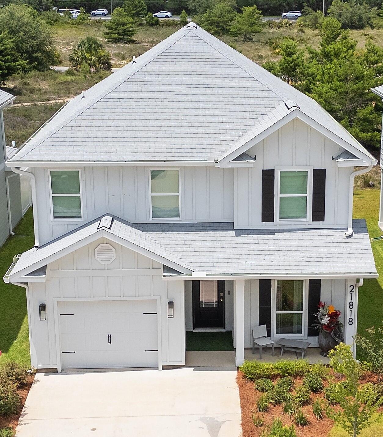 This lovely 4-bedroom, 3.5-bath home in a non-rental neighborhood is a true showpiece, thoughtfully upgraded with high-end features throughout.  From the moment you step inside, you'll notice the designer touches to include custom paint, striking accent walls, and showcase light fixtures that elevate every space. The open-concept floor plan is enhanced by smart home technology, large wall-mounted TVs, and a dedicated media room with surround sound, ideal for entertaining or relaxing in style. The main-level primary suite offers convenience and privacy, while three spacious bedrooms upstairs are complemented by a secondary living room/flex space, perfect as a playroom, teen retreat, or second entertainment area.