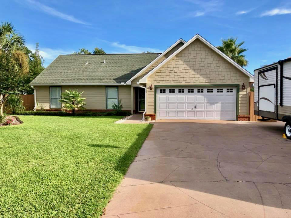 If you are looking for a house that has it all, look no more. This FIVE bedroom, THREE bath home is a rare find. Care of ownership is evident all around. As you approach the home you will note the extra pad in the driveway for storing your RV or boat. The house is equipped with full hook ups. There is a 50 amp outlet in the garage and a sewer hook up on the side of the driveway. Upon entering you will see tile floors in the kitchen, as well as all stainless steel appliances. The living room and dining room have all hardwood flooring and the open attached FL room has all tile floors and beautiful shiplap walls.  The downstairs has two guest rooms and a guest bath as well as the master suite. Upstairs you have two large guest rooms and a full guest bath. Making the upstairs a great private area for guests. The home has its own backyard oasis and it's where you want to be, with heated pool and hot tub you can use it year around. Another great perk to this home is the low energy bills due to the solar panels that come with the home. They are completely paid off, so no need to worry about taking over any financing. Home comes with entire RING security system, including spotlight cameras on front and back as well as doorbell and a smart thermostat.  This home is move in ready and ready for its new owners. The HOA is voluntary, but membership offers beach access as well as attendance to all the neighborhood events, including a large 4th of July party and fireworks display. The neighborhood is a dream and a hidden gem tucked away off of 98.