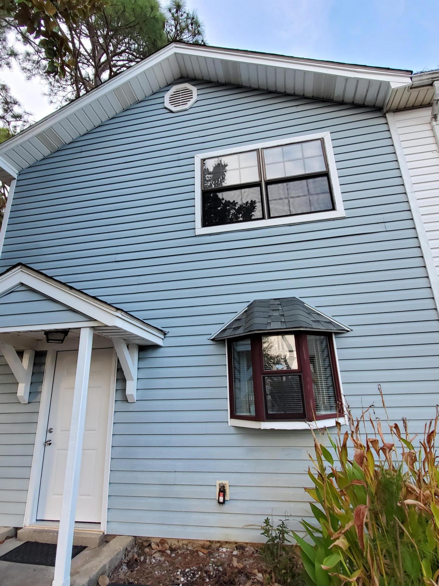Move in ready end unit located by nearly everything! This two bedroom one and a half bath townhouse has fresh paint and new doors throughout. Washer and dryer hookups in the unit and a storage shed on the back porch. New flooring on the stairs and throughout second floor. The best thing about this home is the HOA covers exterior and roof!