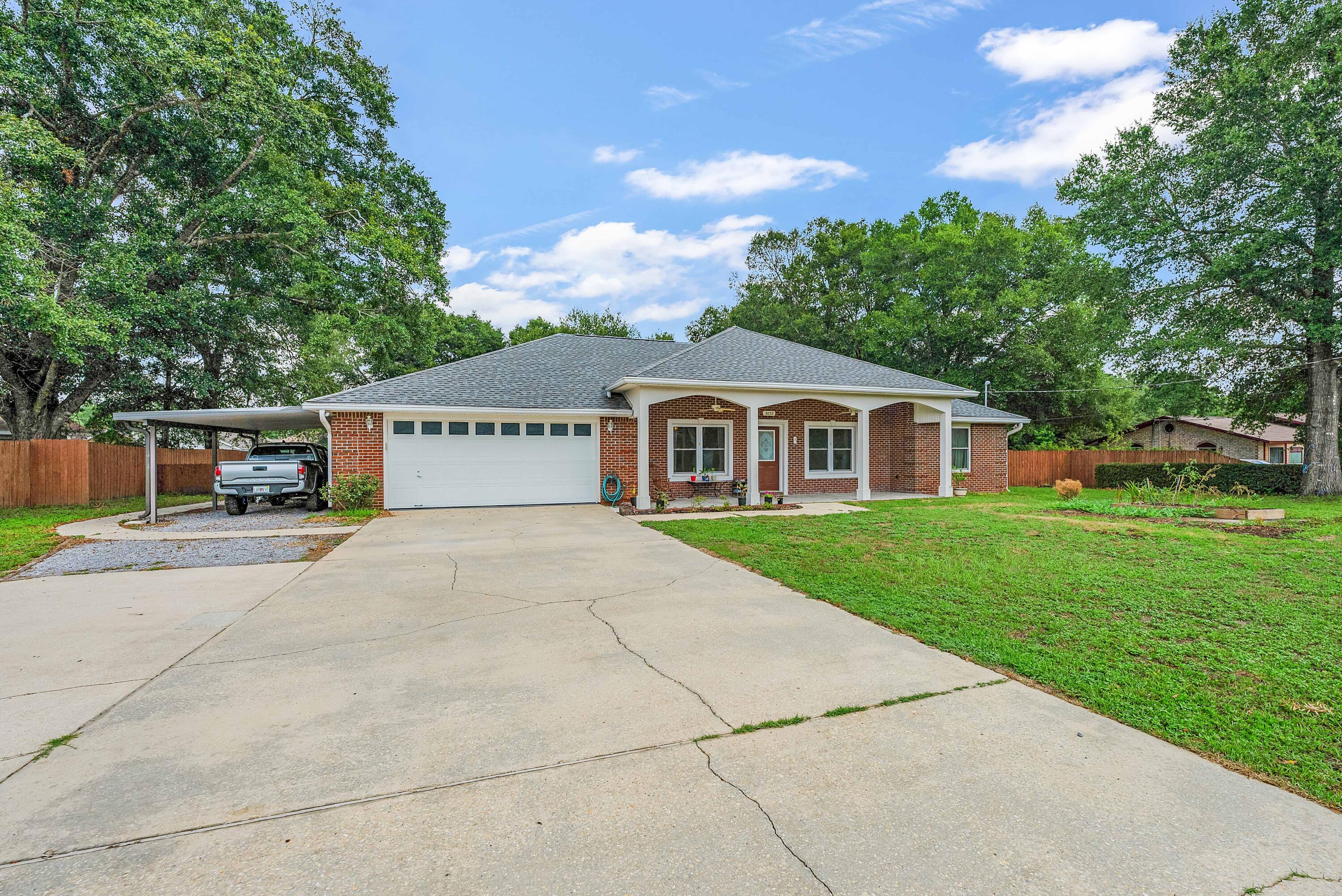CURB APPEAL with this ALL brick home located on a level 1/2+ acre of land. 2018 RENOVATED kitchen, large country porch, screened porch, WORKSHOP, Outdoor Fire Pit and more! Step into the Living Room and you have a clear view to the back yard. Vaulted ceiling in the Kitchen and tray ceiling in the Dining and Master Bedroom. Plus a double Pantry to add to the expansive cabinets along w/all of the Kitchen appliances to include: GAS Range and Quartz countertops. View of the Fenced back yard from the Kitchen Sink and an oversized Laundry Room has a laundry sink and room for 2 chest type freezers. 2017 Roof, 2013 HVAC Gray shed conveys AS/IS