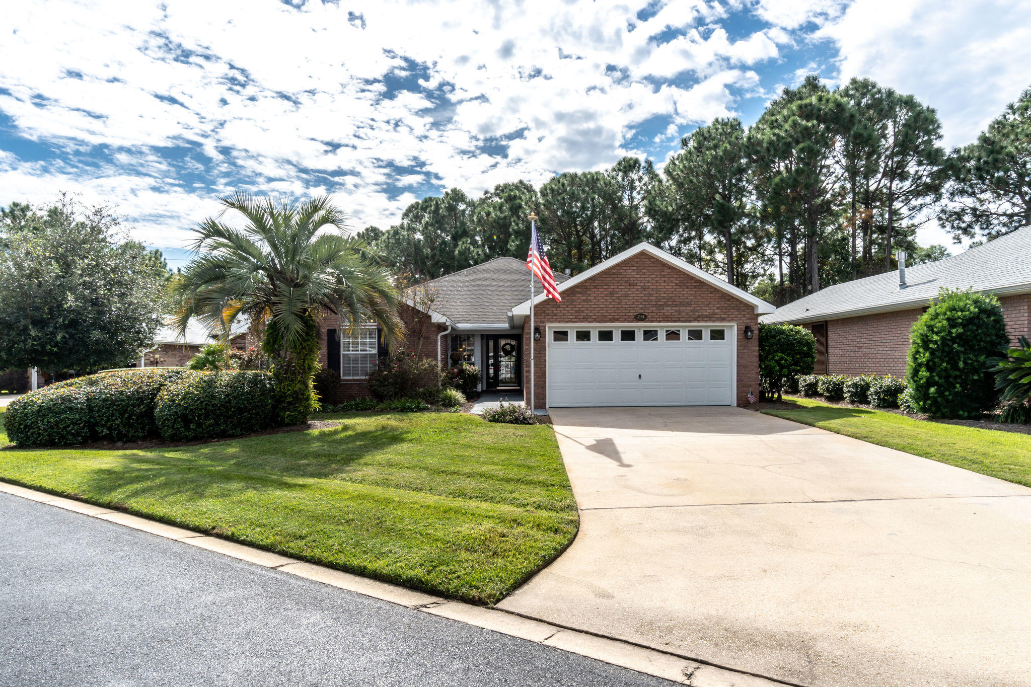 Move-In Ready! This home won't last long! One of the larger lots in Treetops at Bayside, this updated 3BR/2BA home sits on nearly -1/4 acre lot well-fitted with plush landscaping. As you pull into the driveway of this brick home, Old Glory will greet you as it proudly waves in the air. The living & kitchen areas boast recessed lights. Over 200sqft of outdoor living space, the covered/screened patio opens up to the backyard that's enclosed with a black metal fence. A 2-car garage has plenty of storage w/cabinets & countertop space. Hurricane shutters convey & an active termite bond is transferrable to the new buyers. The location of the home is excellent as it backs up to a wooded area for ultimate privacy. Buyer to verify all details. See a full list of upgrades in the documents section.
