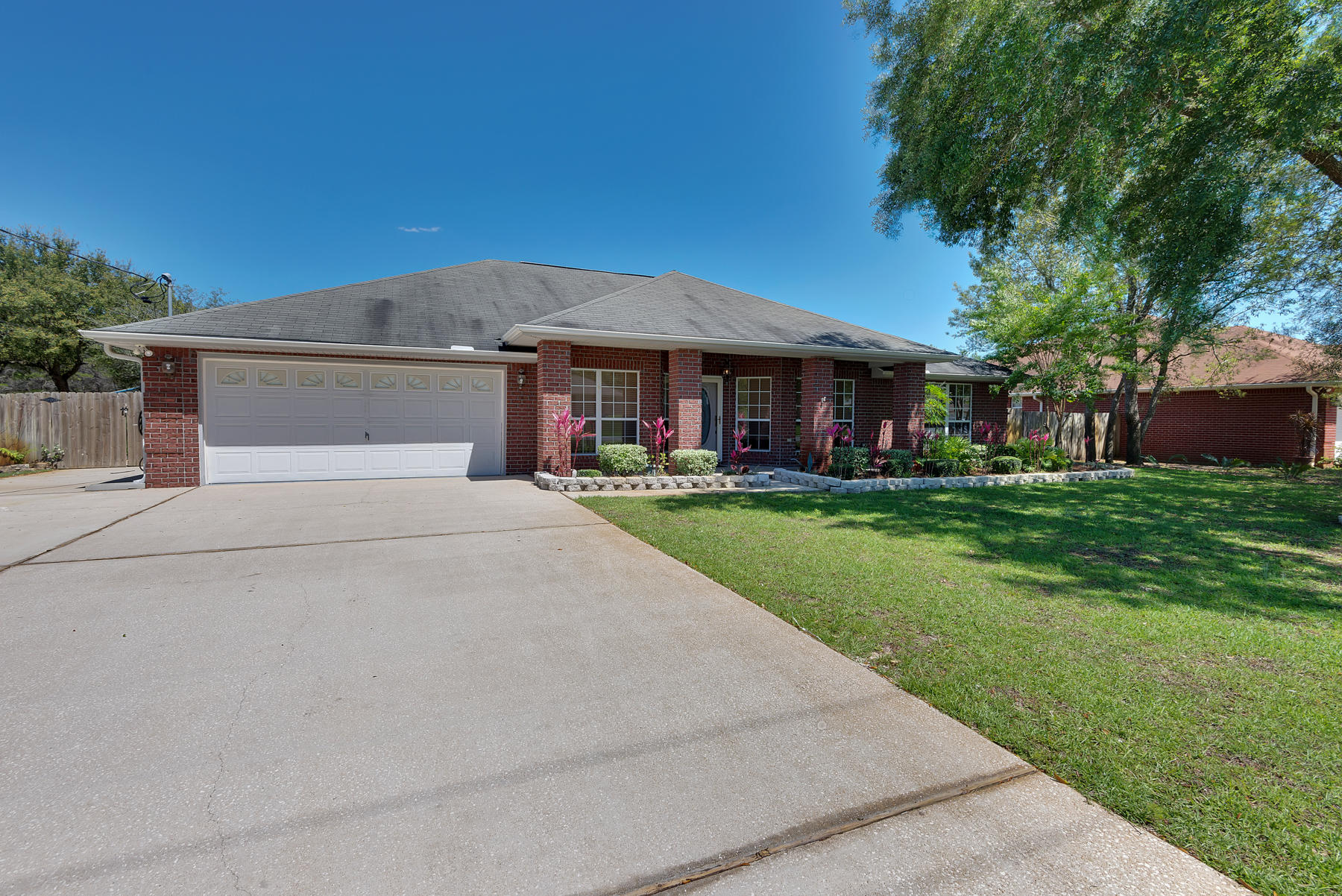 One-of-a-kind Pool with Sunroom home in Holley by the Sea offers the finest in Florida Living! Click on the photos and Video Tour to discover the elements that you've always wanted in a High Quality of Life home at an excellent price! With over 3500 sq. ft. under roof, it lives large with its wonderful open layout, wood flooring (in the great and formal dining room), 4 bedrooms, Massive Kitchen/Breakfast Nook with Stainless Appliances, Granite Counter Tops, and the outstanding light level throughout created by the oversized (574 sq. ft.) screened sunroom that leads out to the saltwater pool, deck and beautifully landscaped and fenced backyard. Pick your own fruit from the lemon, grapefruit and papaya trees, and have plenty of room for tools and storage in your outdoor shed. Make your appointment to see it today