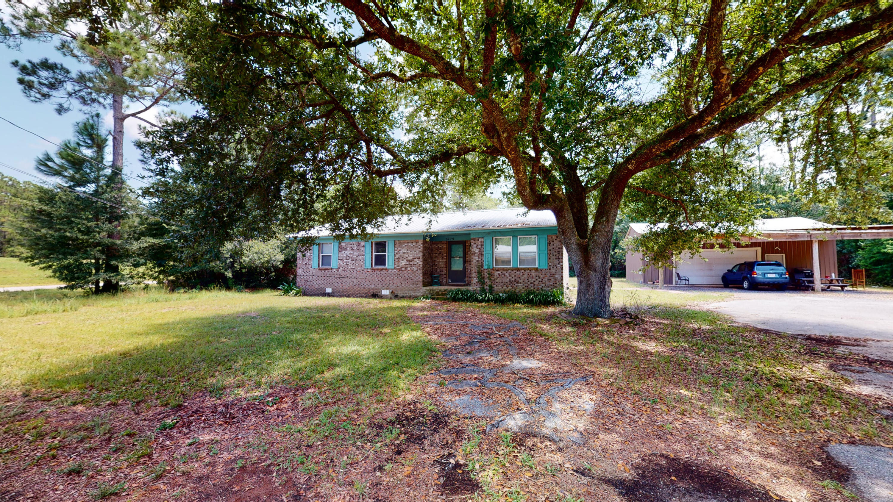 **Click on link to view virtual tour!!***

FULLY FURNISHED ranch style home is on a double lot in the Avalon Beach area and only a short distance from I10, Pensacola and the beaches, and when headed in the other direction, you are close to Whiting Field and plenty of Milton/Pace shopping and dining. This is a great 3 bed/2bath with some upgrades including a newer metal roof and vinyl clad windows.  Updated vinyl plank flooring throughout.  Bathrooms have newer vanities and the master bath has custom ship lap walls.   The kitchen and dining area are open to the living area, creating an open floor plan. The laundry room is located inside. Call today to schedule your showing. This is in an AE Flood zone.  All personal items, including items in the workshop, will be removed prior to closing.