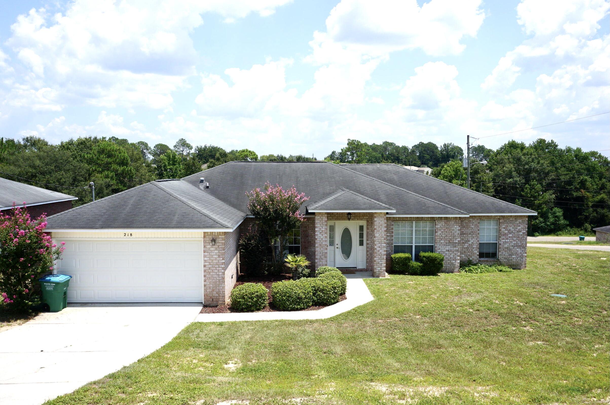 Available NOW!!!.......South Crestview home features easy commute and convenience to all bases, beaches & shopping. 4/2 Open concept living boasts dark wood flooring in the main living areas, kitchen island in the spacious kitchen, formal dining room or office space, split floor plan, large bedrooms, large laundry, eat in kitchen area, 2 car garage, and open back patio. Kitchen cabinets are being painted this week. Whole house being painted.  No inside smoking. Pets will be considered with a $400 non-refundable pet fee. Data entry only, call owner direct. 850-502-9117.