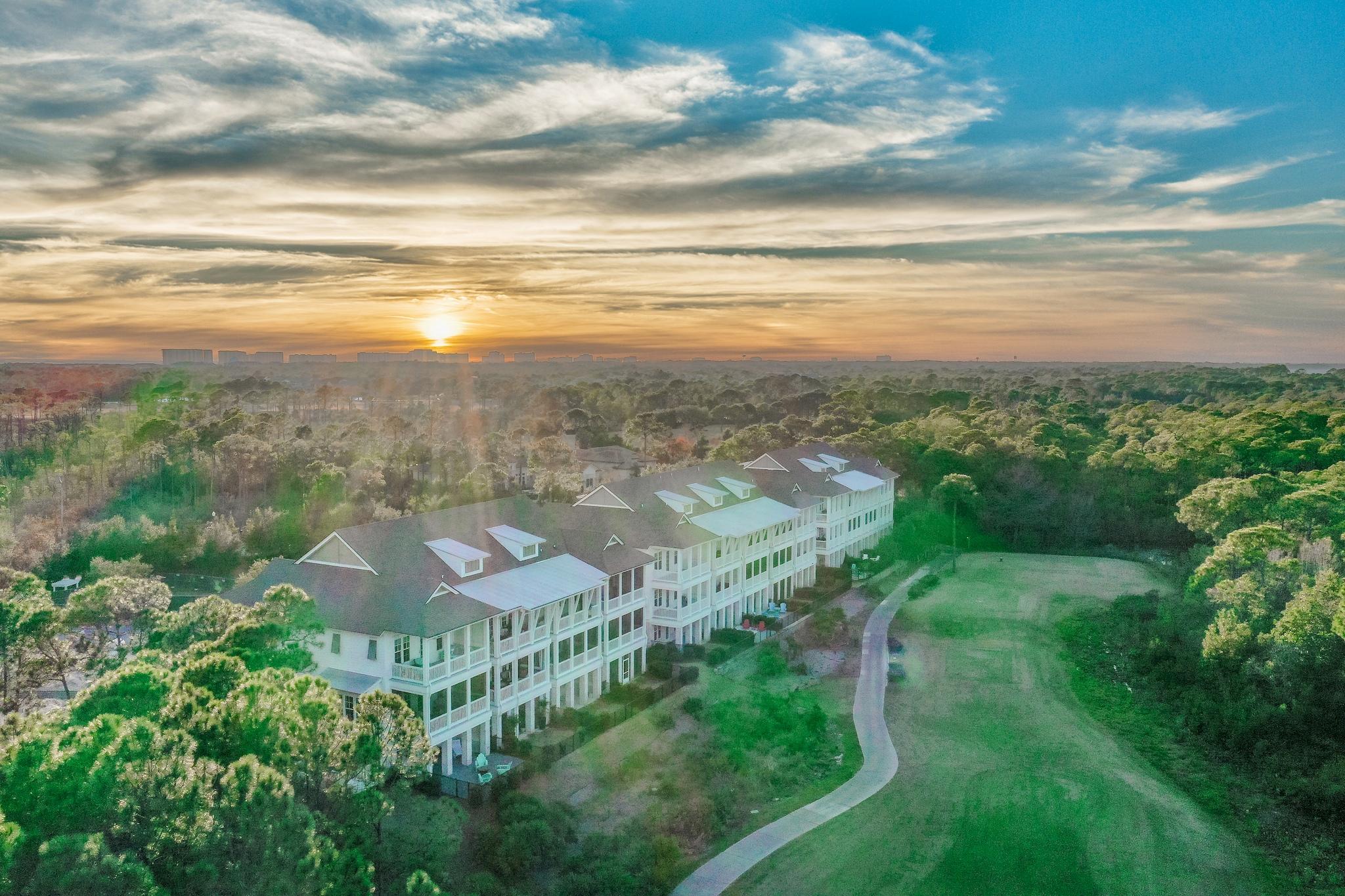 Perfection with spectacular bay views throughout!  This gorgeous end unit, three story town home overlooking the 3rd hole of Kelly Plantation's Golf Course is built to perfection.  Unlike the other Brownstones this one offers unobstructed spectacular bay views, an easement to the side has a wooded area to maintain privacy and this Brownstone boasts the largest square footage.  The kitchen is an entertainer's dream with a Wolf stove, Sub Zero appliances, coffee bar, oversized island and conversational area.  The home features an elevator and large two car garage for everyday convenience. The master suite offers beautiful views, a large walk in closet and master bathroom suite with a coffee bar built for relaxation in mind.  The home has high end fixtures and custom barn wood porcelain tile floors throughout.  The backyard has a paved and fenced in area. Start your new life at the beach sitting on your oversized balconies relaxing watching the boats with your gorgeous bay views!

**Buyer to verify all measurements and information**
**Porch Swing Bed Excluded from the sale**