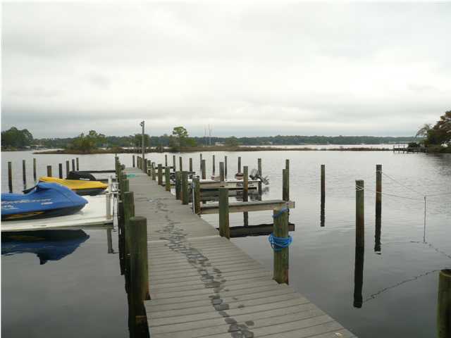 AVAILABLE JUNE 23, 2018!!! Deep water boatslip available in a protected cove just off Rocky Bayou! Two stories with three bedrooms, 2 1/2 baths, plus the garage has been converted into a bonus room and storage. The great room has a beautiful floor to ceiling stone fireplace with hearth and a mirrored wall to make the room feel even larger. There's room for a dining room table and stools at the breakfast bar. Under the stairs is used as a pantry and storage area. Upstairs you'll find three nice sized bedrooms and two full baths (of course, one is a master suite). Sorry, no indoor smoking and not pets.