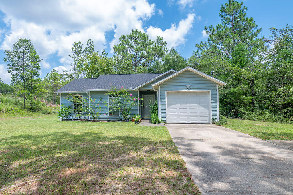 This unique offers the best of country living on a spacious 1-acre lot. This home is strategically located for easy access to nearby amenities, a quick commute to town, and close proximity to main highways 188 (Airport Rd), 85, and 90 to take you to work or have fun; 35 miles away to our Emerald Coast sugary Beaches and conveniently situated near military bases such as the 7th Special Forces Group and Eglin Air Force Base.

Nature lovers, this home includes a beautiful, untouched wooded area behind the house, approximately 0.35 of an acre in size; it provides ample space to enjoy private woods, expand your garden, or create a workshop with endless possibilities. The Tiny House/Shed "DOES NOT" convey with the sale, but it is negotiable. It will add further value and potential to this fantastic deal and provide extra office space, a workshop, or an exercise room. The shed is insulated, drywalled, has power, and has no tied-downs, making it easy to move to a new desired location.

Recent upgrades provide peace of mind: Enjoy the benefits of a newly installed HVAC system (2022), water heater (2021), and roof replacement (2019),  making the home ready for potential savings on your home insurance.

Take advantage of this incredible opportunity! Contact us today to schedule a viewing and make this dream property yours.