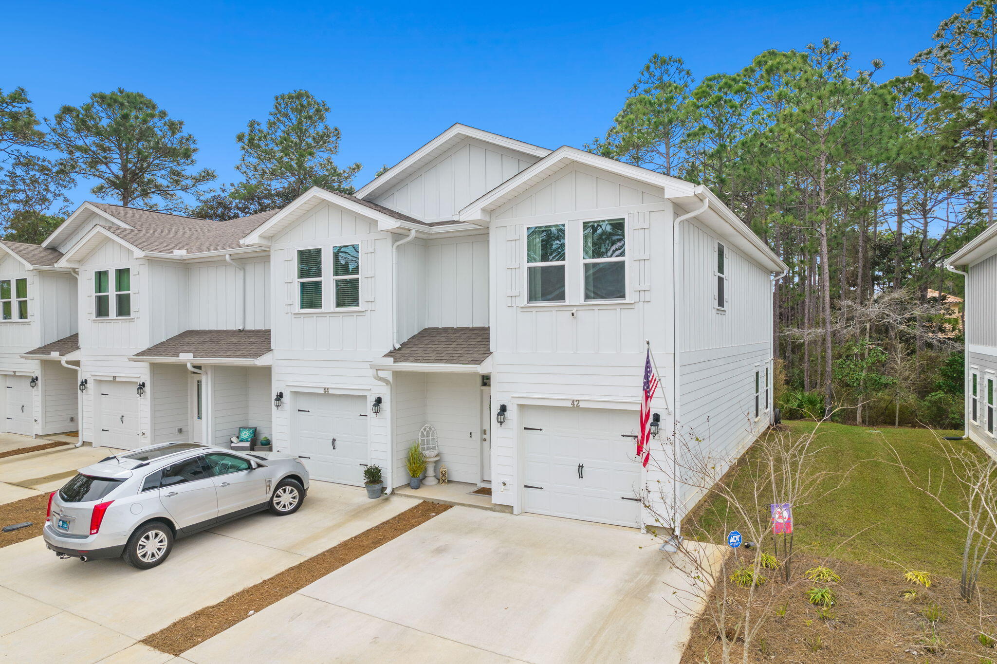 Welcome home to this meticulously maintained end unit townhome in Sandhill Pines! This beautifully furnished home has been a full time residence for the owners since its completion. Upgraded lighting greets you in the entryway and leads you to an open kitchen featuring granite countertops, stainless steel appliances, and a water filtration system. The open floor plan in combination with the half bath on this level make the ideal space for entertaining guests. The second level features a separated master suite and two other bedrooms with a shared bathroom. All bathrooms present with upgraded fixtures, and an upstairs laundry room lends convenience.  

Sandhill Pines offers close proximity to Grand Boulevard, Sacred Heart Hospital, and is just a short drive to the beaches of South Walton.