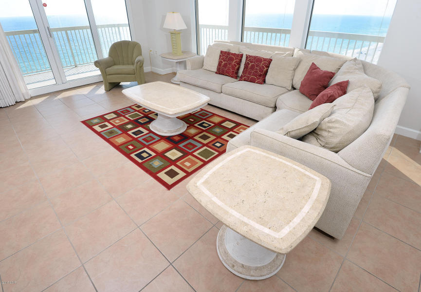 The pinnacle of Gulf front living! This Beautiful 2BR/Bunk/3BA condo offers what some consider to be the best views from any condo in any development in Panama City beach. Massive wrap around balcony is accessible from each bedroom and allows for breathtaking views of the Gulf and Bay. Bank of large windows along the west wall maximizes views from the interior. Pride of ownership really shows in this one of a kind property  new paint and carpet in 2017! Open concept kitchen with ample cabinets and counter space overlook the main living and dining area. Gulf side master suite boasts large Master Bedroom, garden tub, walk-in shower, and access to the balcony. Bunkroom lives like a 3rd bedroom. HOA dues include electricity.